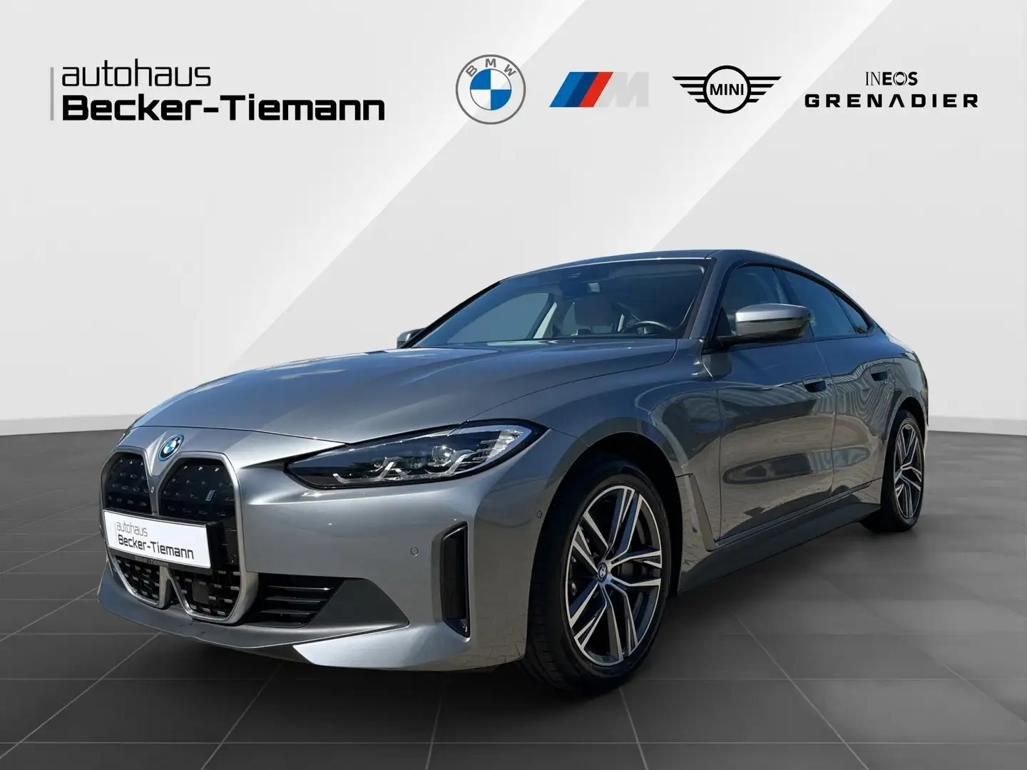 BMW i4 eDrive40 Gran Coupé Leder HUD ParkAss+ HiFi Grijs - 1