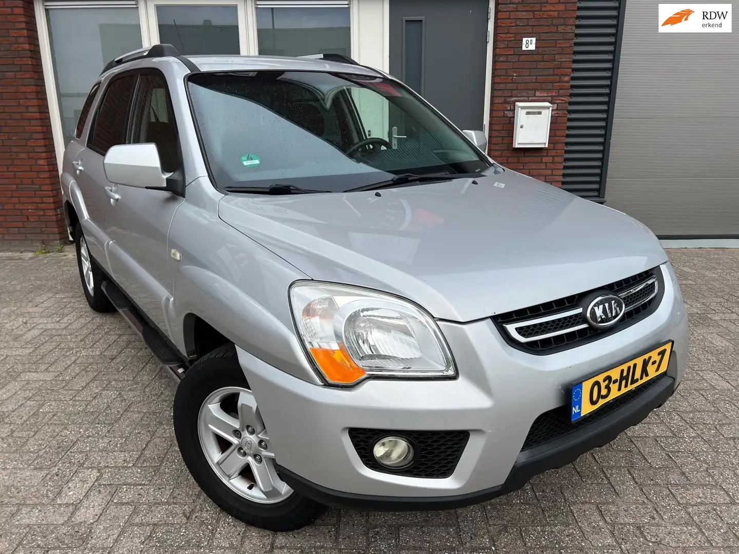 Kia Sportage 2.0 CVVT X-ecutive / Clima / PDC / Cruise / AUX / Gris - 1
