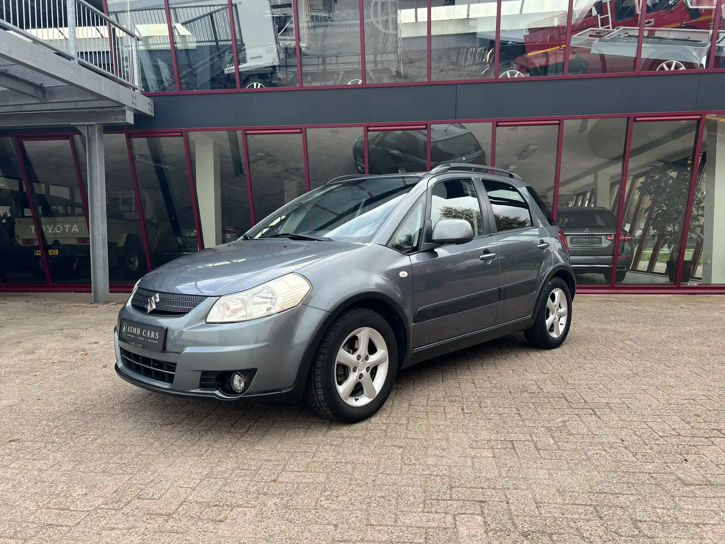 Suzuki SX4 1.6 Shogun | Airco | Trekhaak | Gris - 1