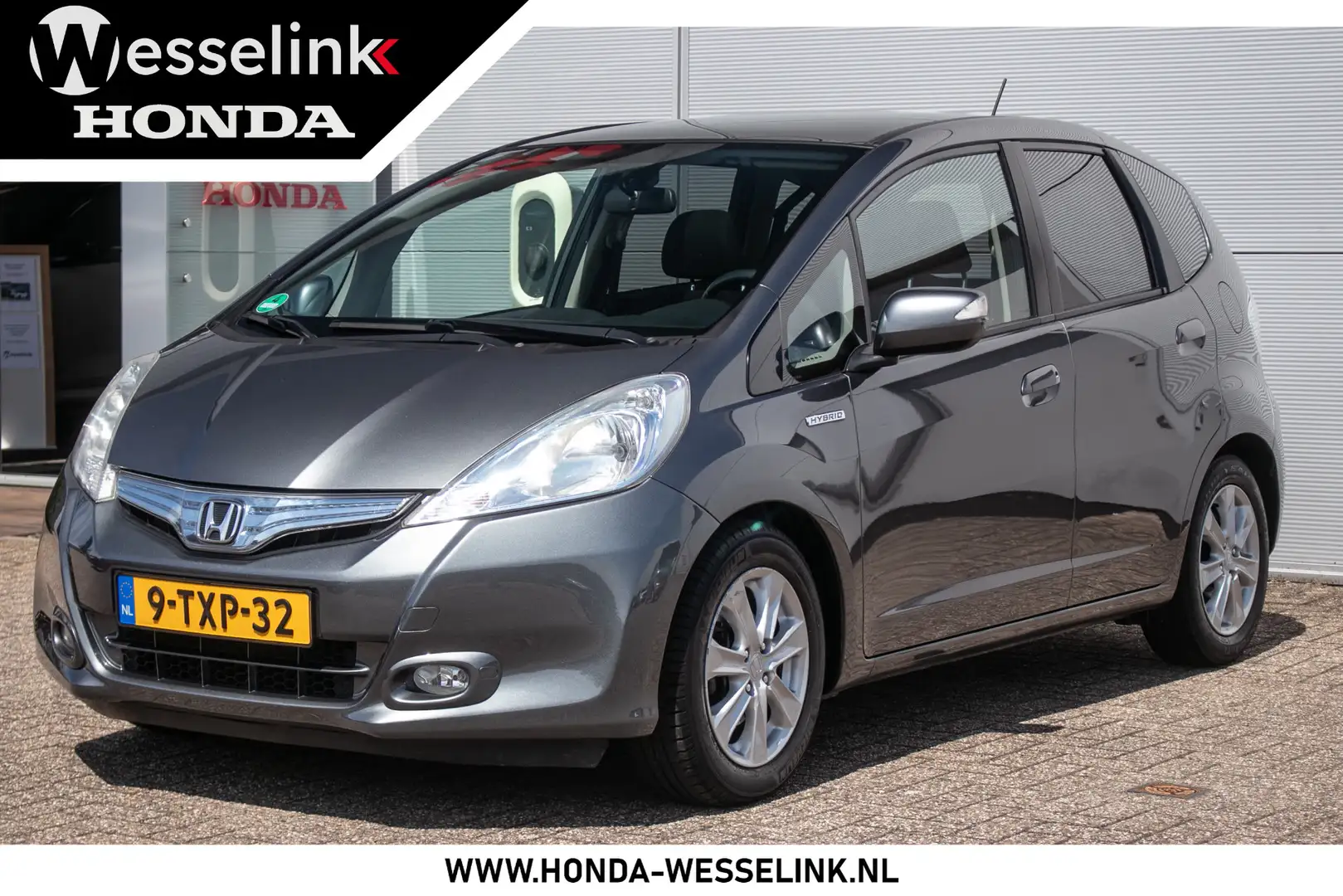 Honda Jazz 1.4 Hybrid Elegance All-in rijklaarprijs | Panodak Grijs - 1