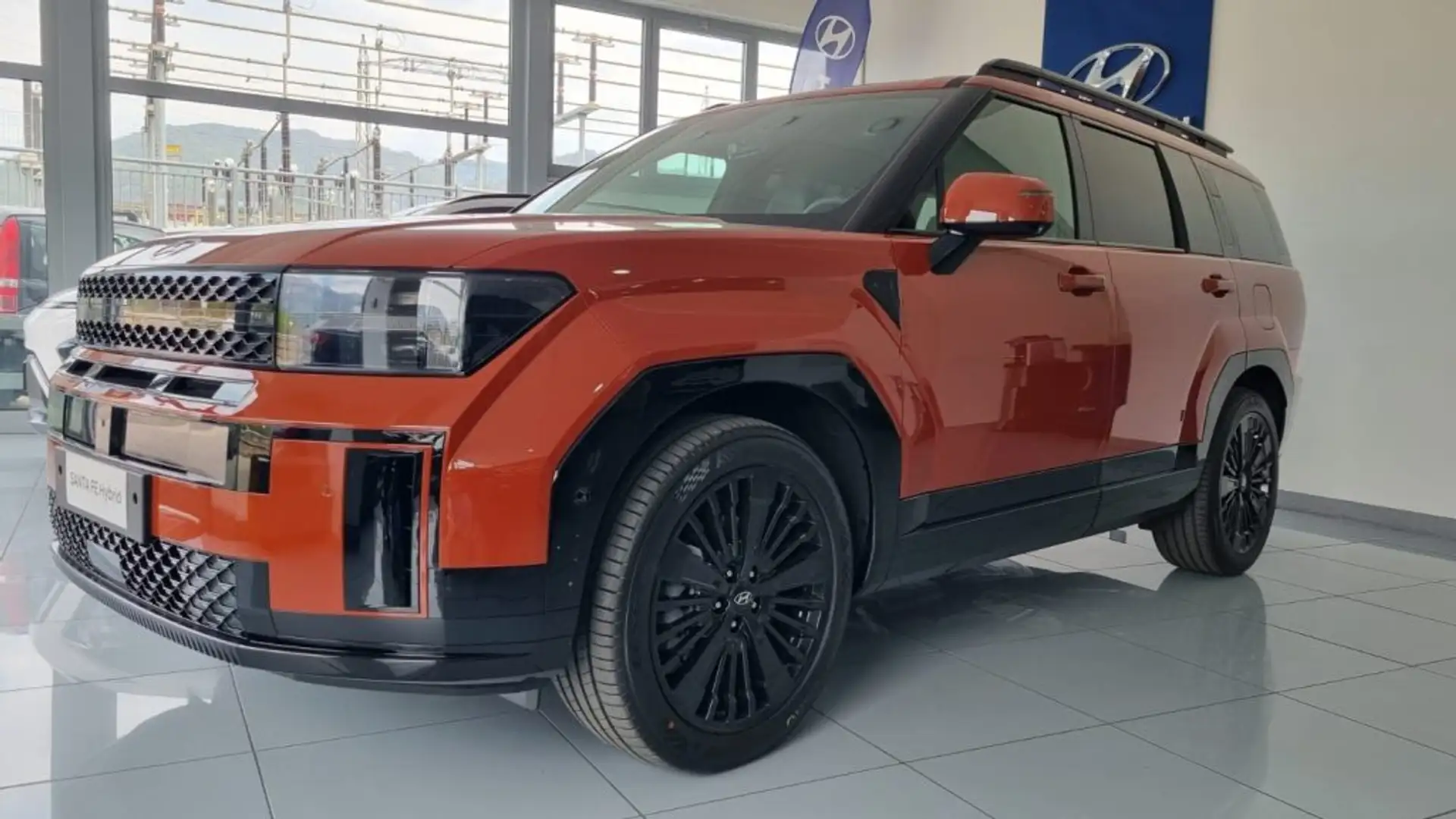 Hyundai SANTA FE 1.6 T-GDi HEV 4WD AT 5 posti XClass Cal.pack Arancione - 1