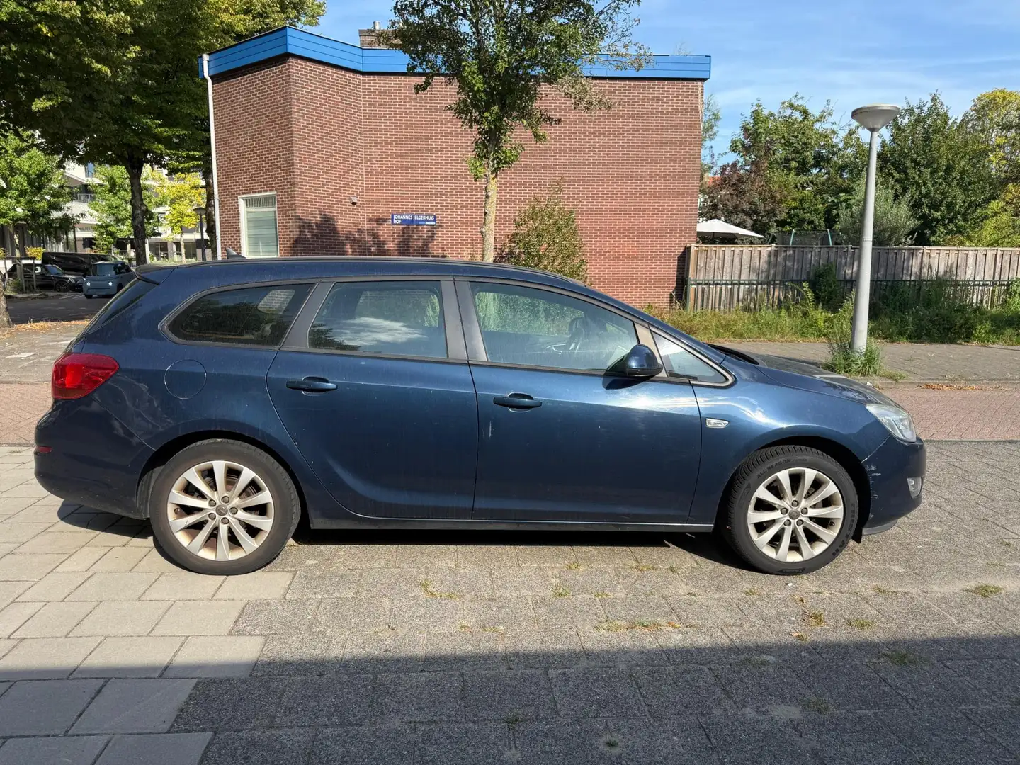 Opel Astra Sports Tourer 1.4 Turbo Anniversary Ed Airco Cruis Blauw - 2
