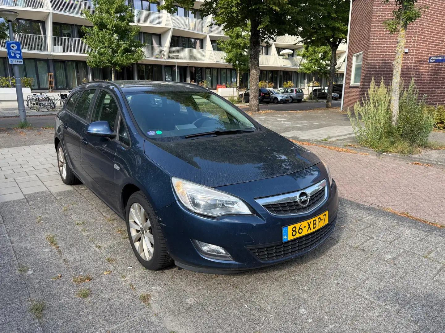 Opel Astra Sports Tourer 1.4 Turbo Anniversary Ed Airco Cruis Blauw - 1