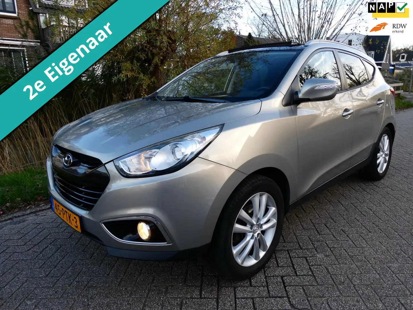 Hyundai iX35 2.0i i-Catcher 163pk 2e eig. Clima Navi Leder Trek Grijs - 1