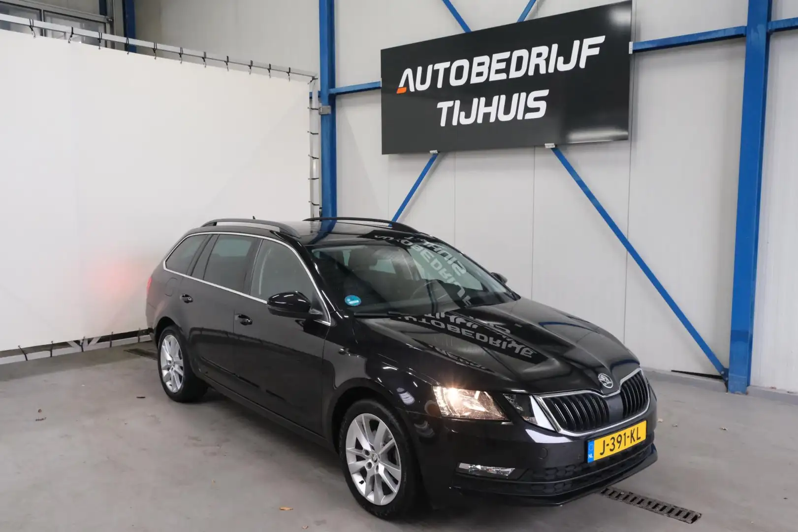 Skoda Octavia Combi 1.0 TSI Greentech Business Edition - N.A.P. Zwart - 1