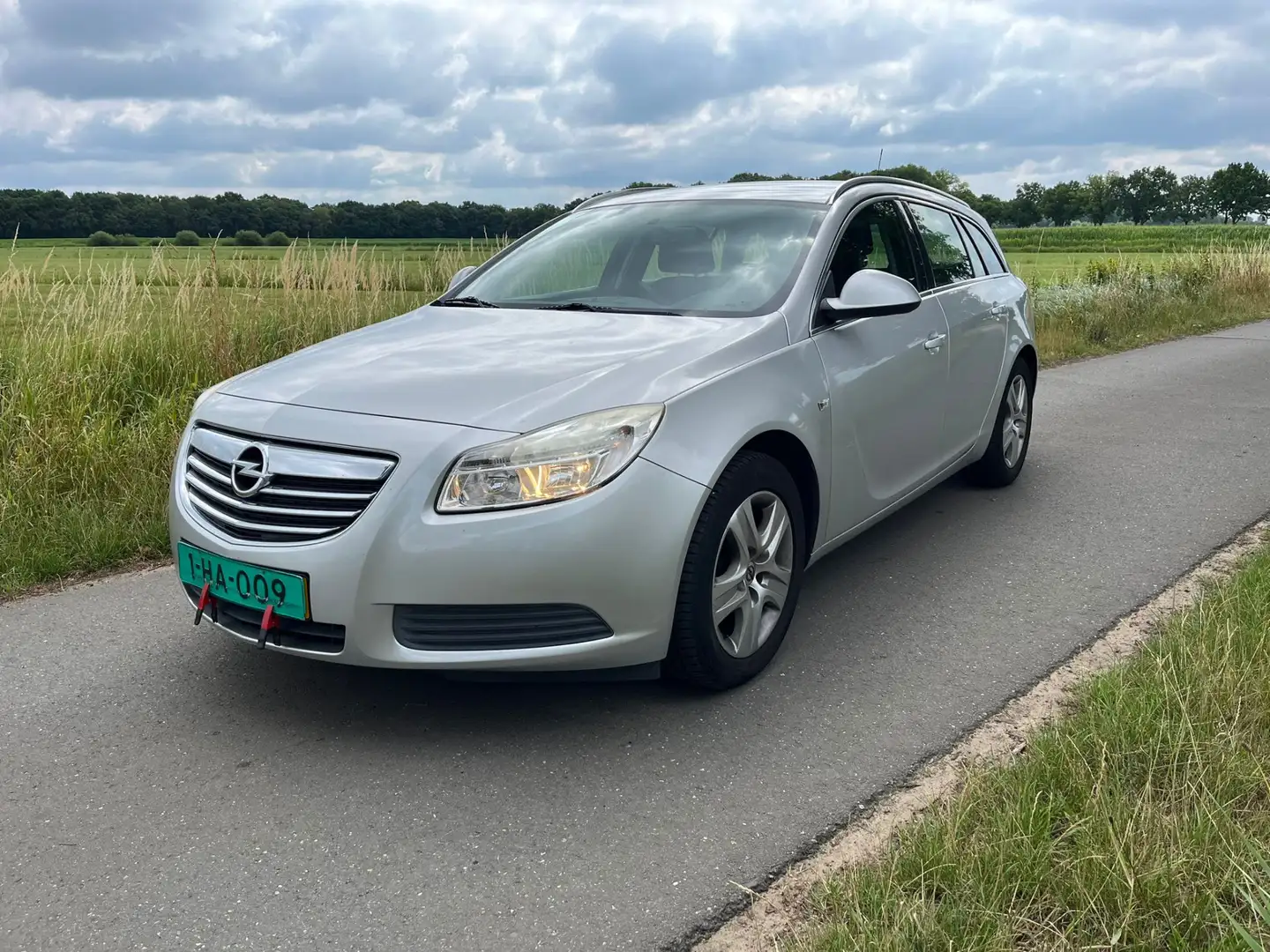Opel Insignia Sports Tourer 1.8 Edition KOPPAKKING DEFECT! EXCL. Grijs - 1