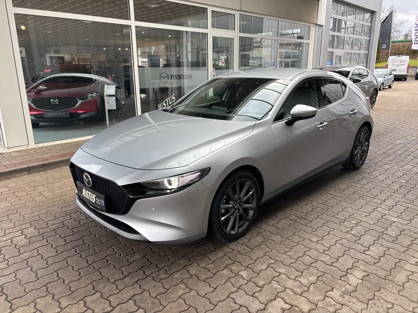 Mazda 3 SKYACTIV-G 2.0 150PS M Hybrid Selection, DES-P., A Silber - 1