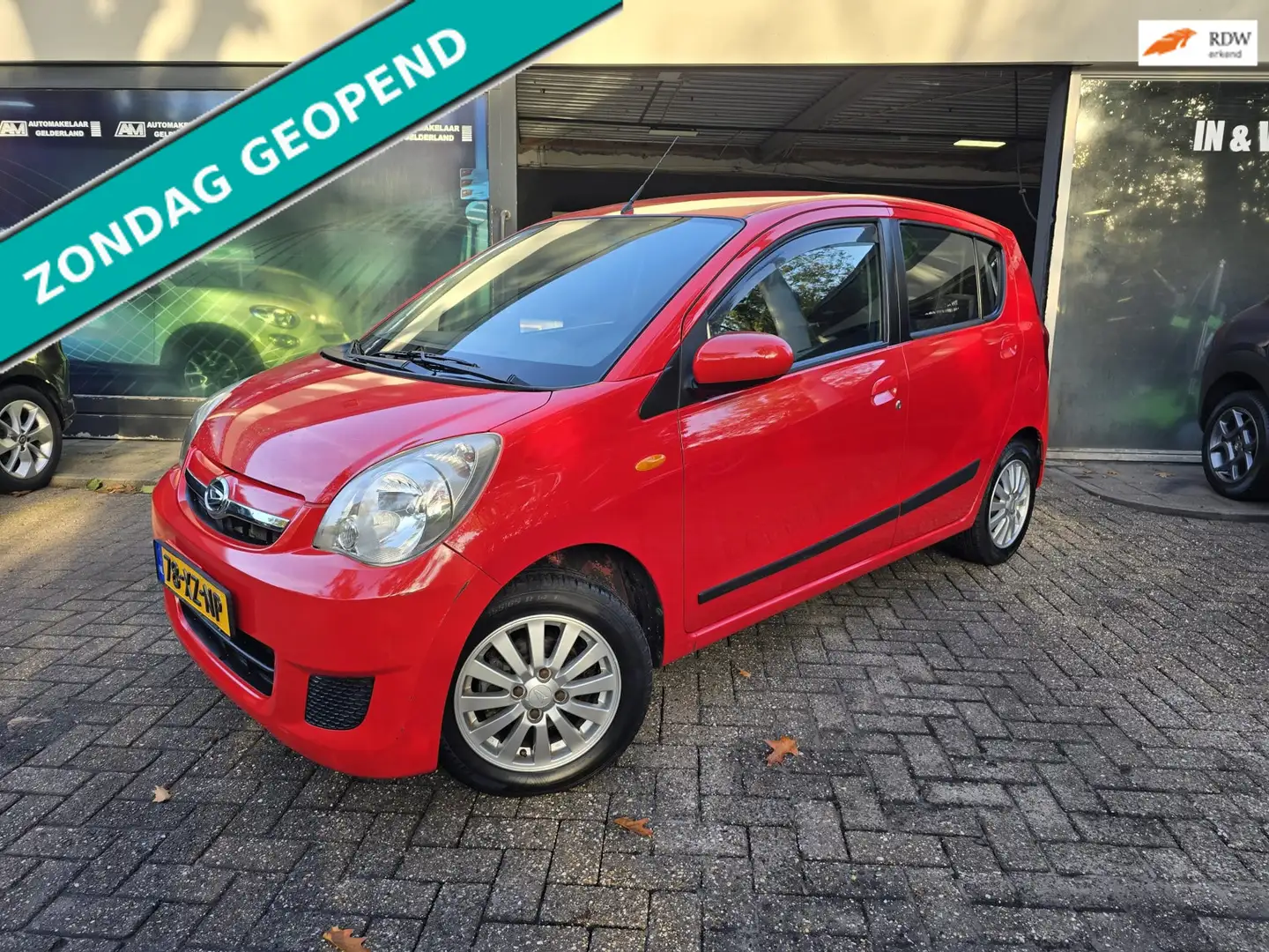 Daihatsu Cuore 1.0 Premium | 2E EIGENAAR | 12MND GARANTIE | NIEUW Rood - 1