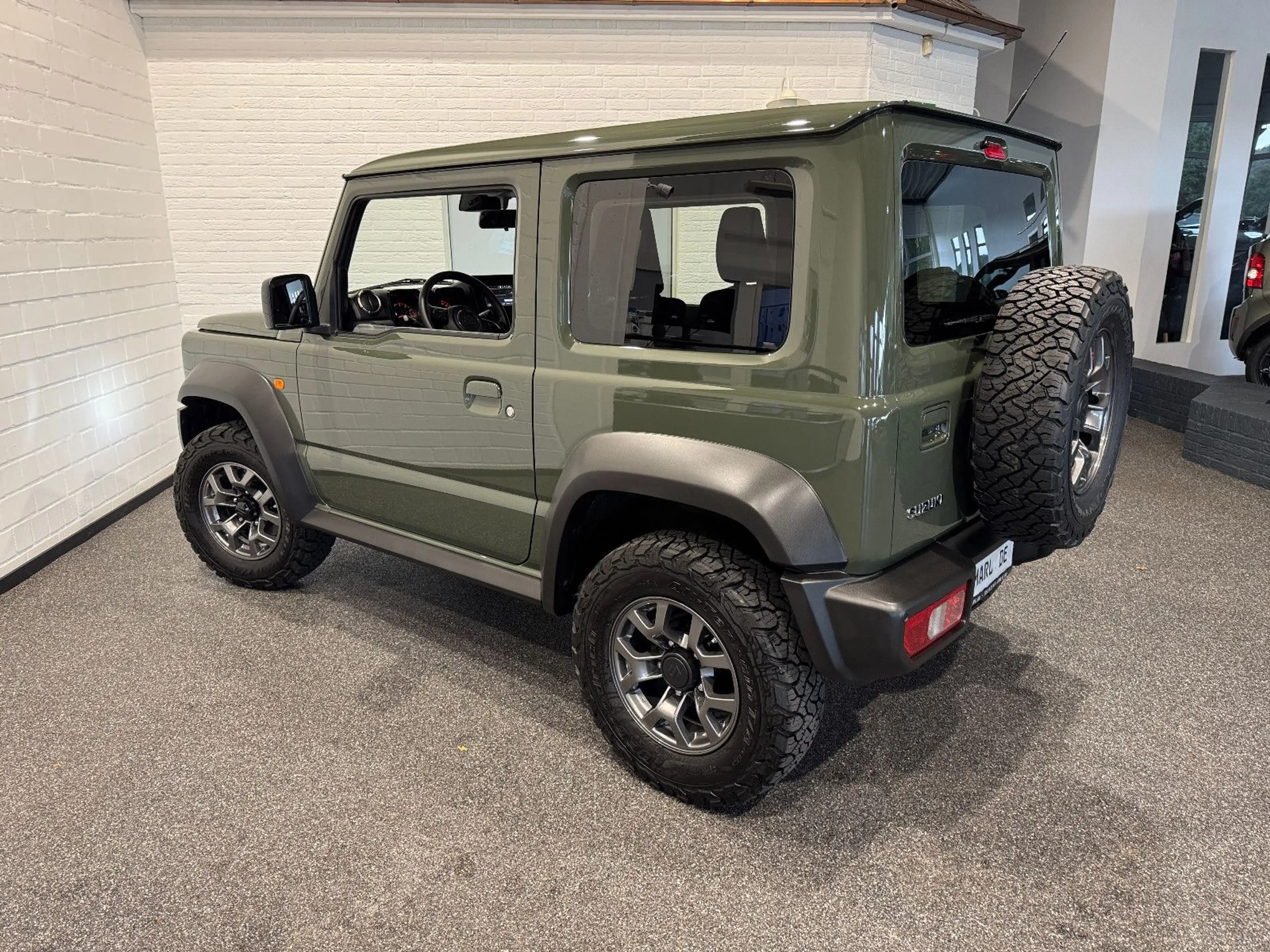 Suzuki Jimny Comfort+ AllGrip NAVI+CAM NEUWAGENZUSTAND! — photo 5