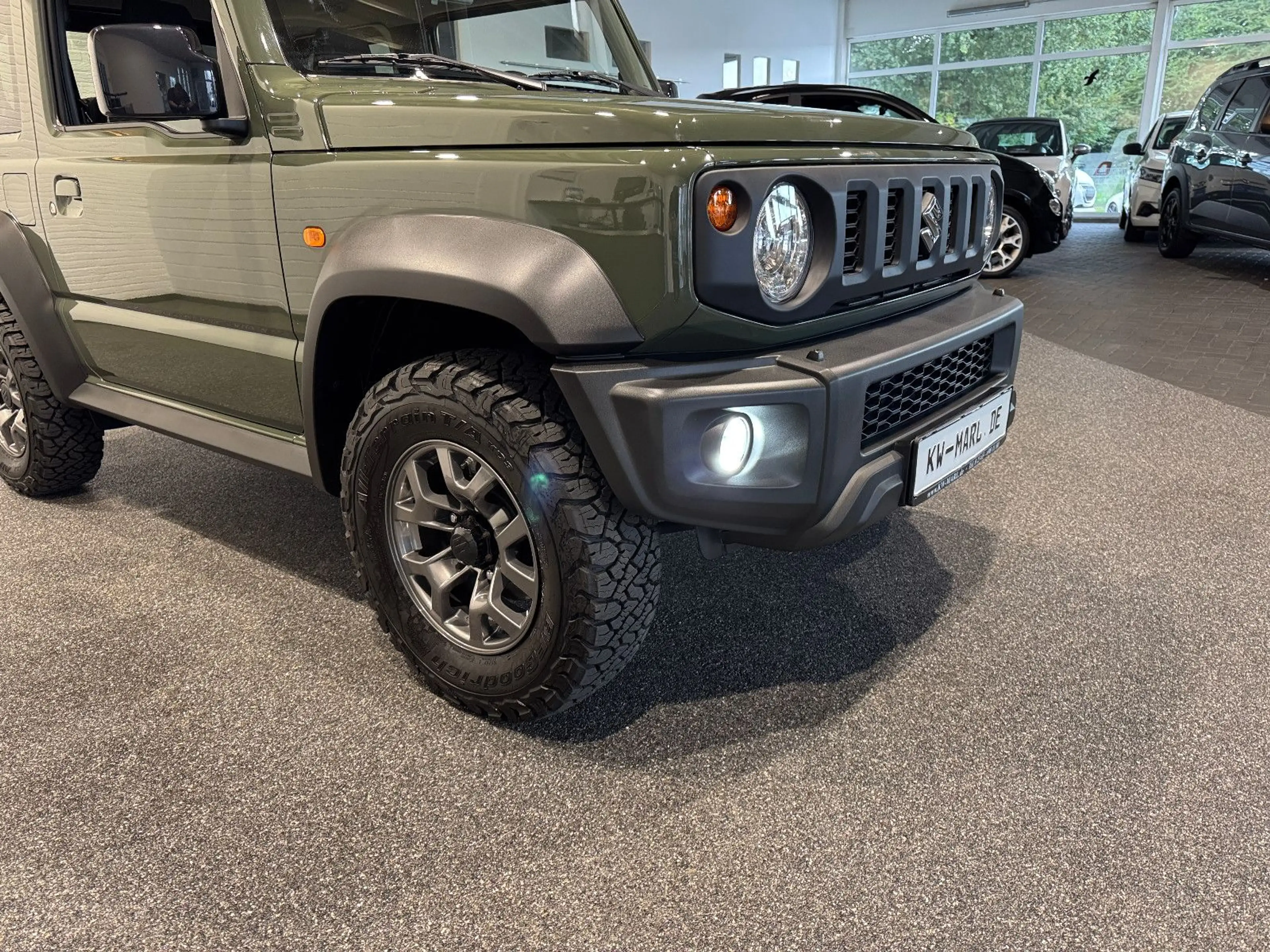Suzuki Jimny Comfort+ AllGrip NAVI+CAM NEUWAGENZUSTAND! — photo 11