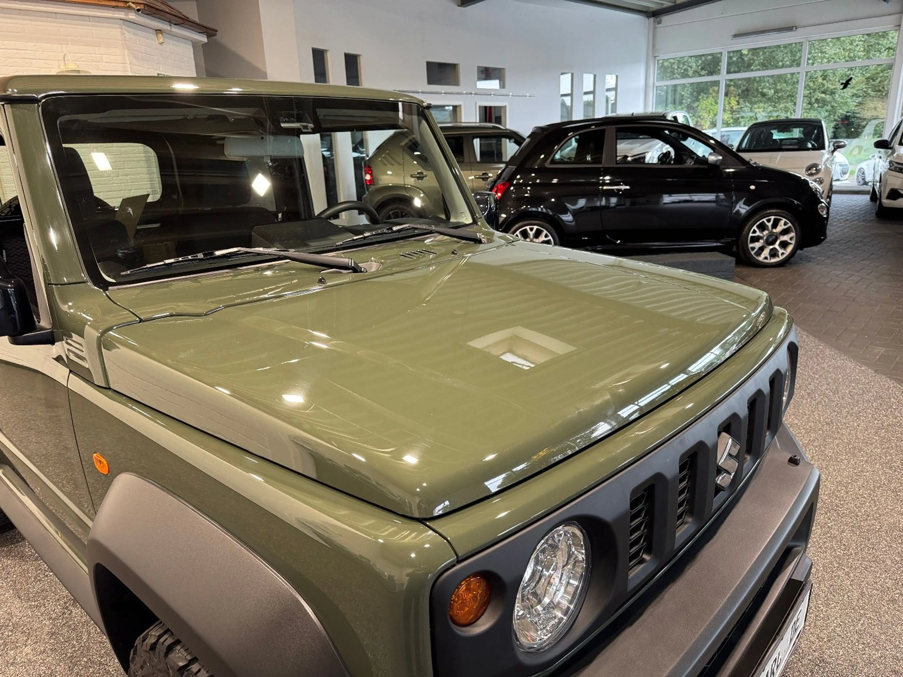 Suzuki Jimny Comfort+ AllGrip NAVI+CAM NEUWAGENZUSTAND! — photo 4
