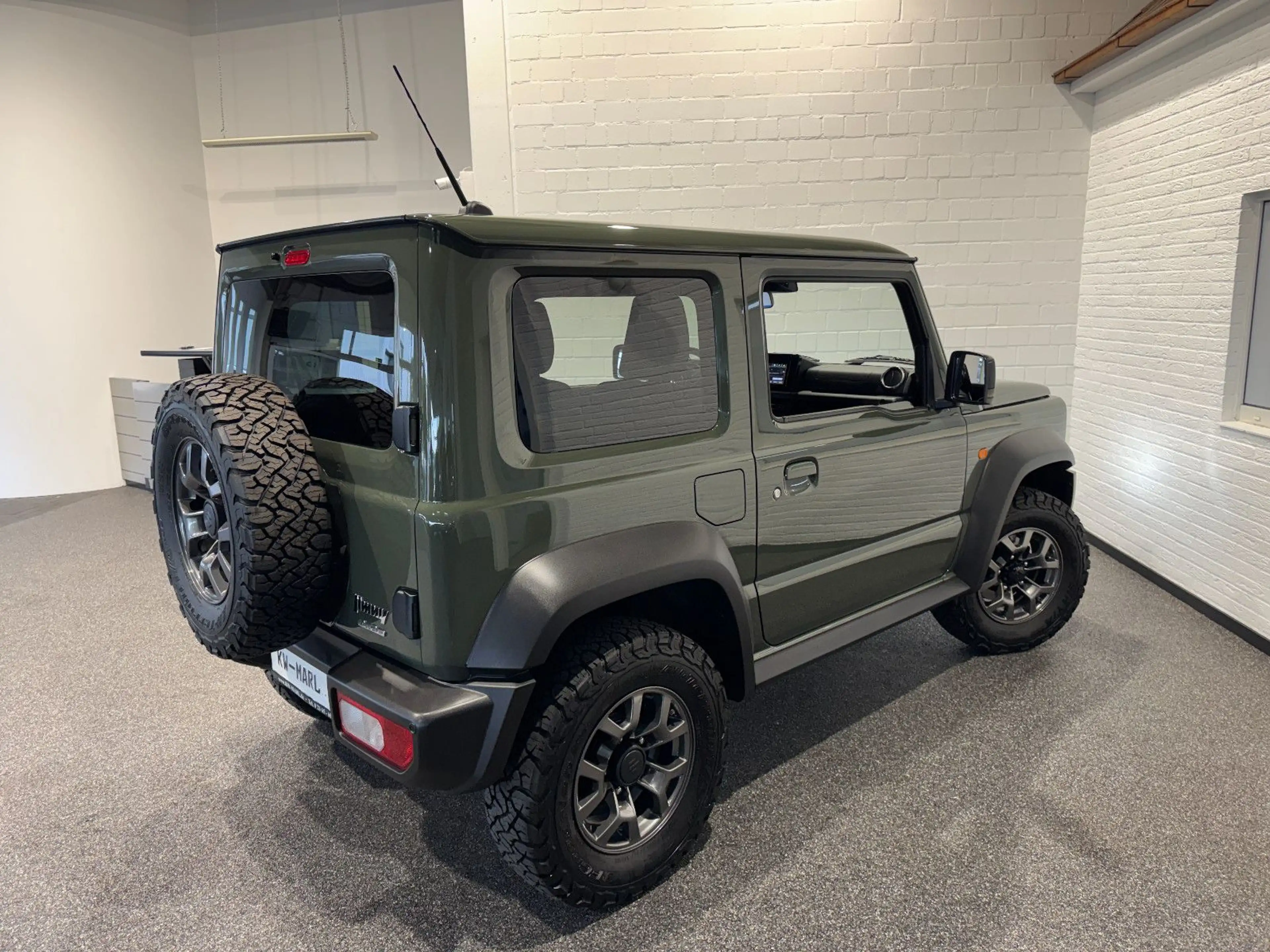 Suzuki Jimny Comfort+ AllGrip NAVI+CAM NEUWAGENZUSTAND! — photo 7
