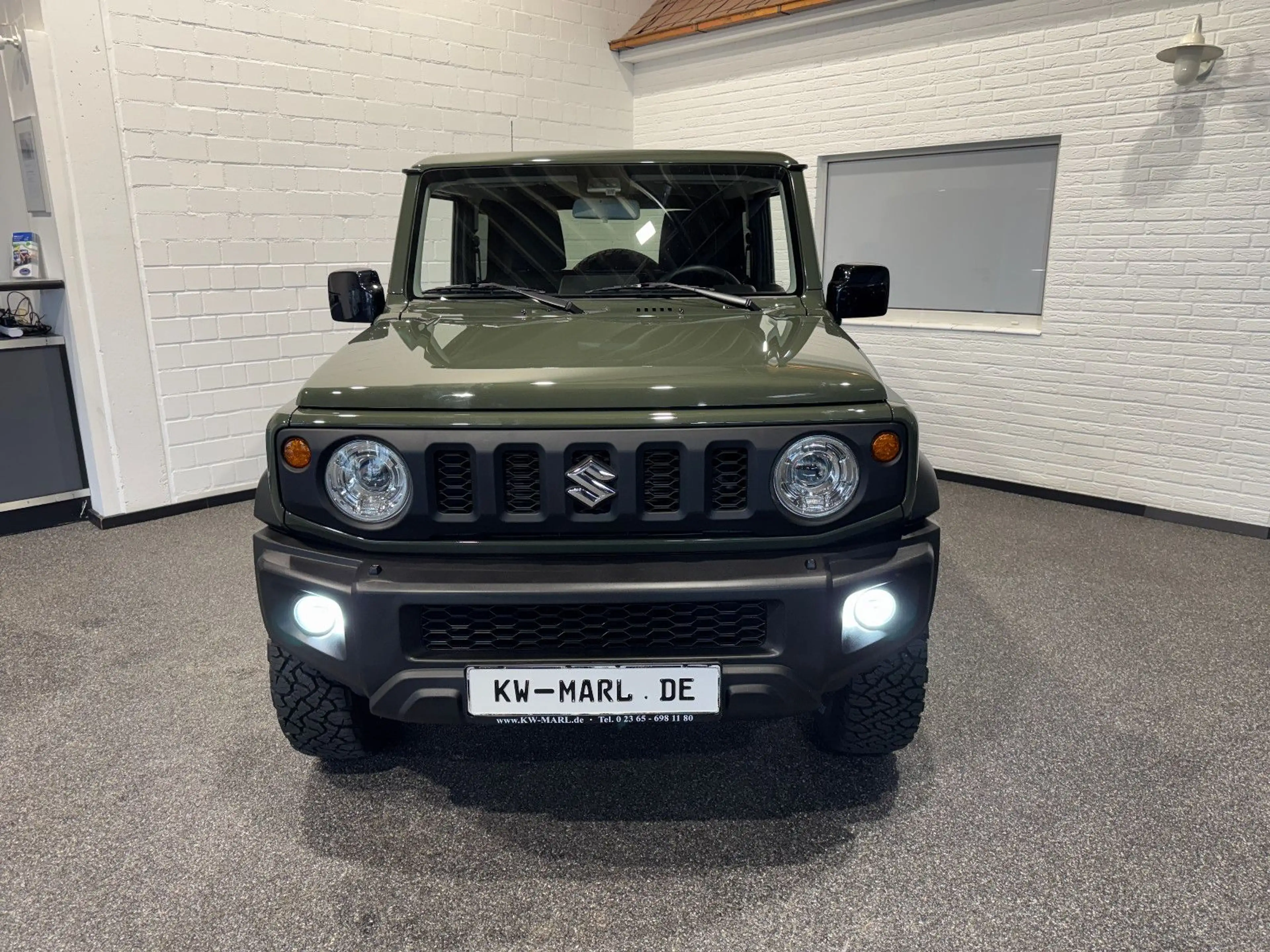 Suzuki Jimny Comfort+ AllGrip NAVI+CAM NEUWAGENZUSTAND! — photo 2