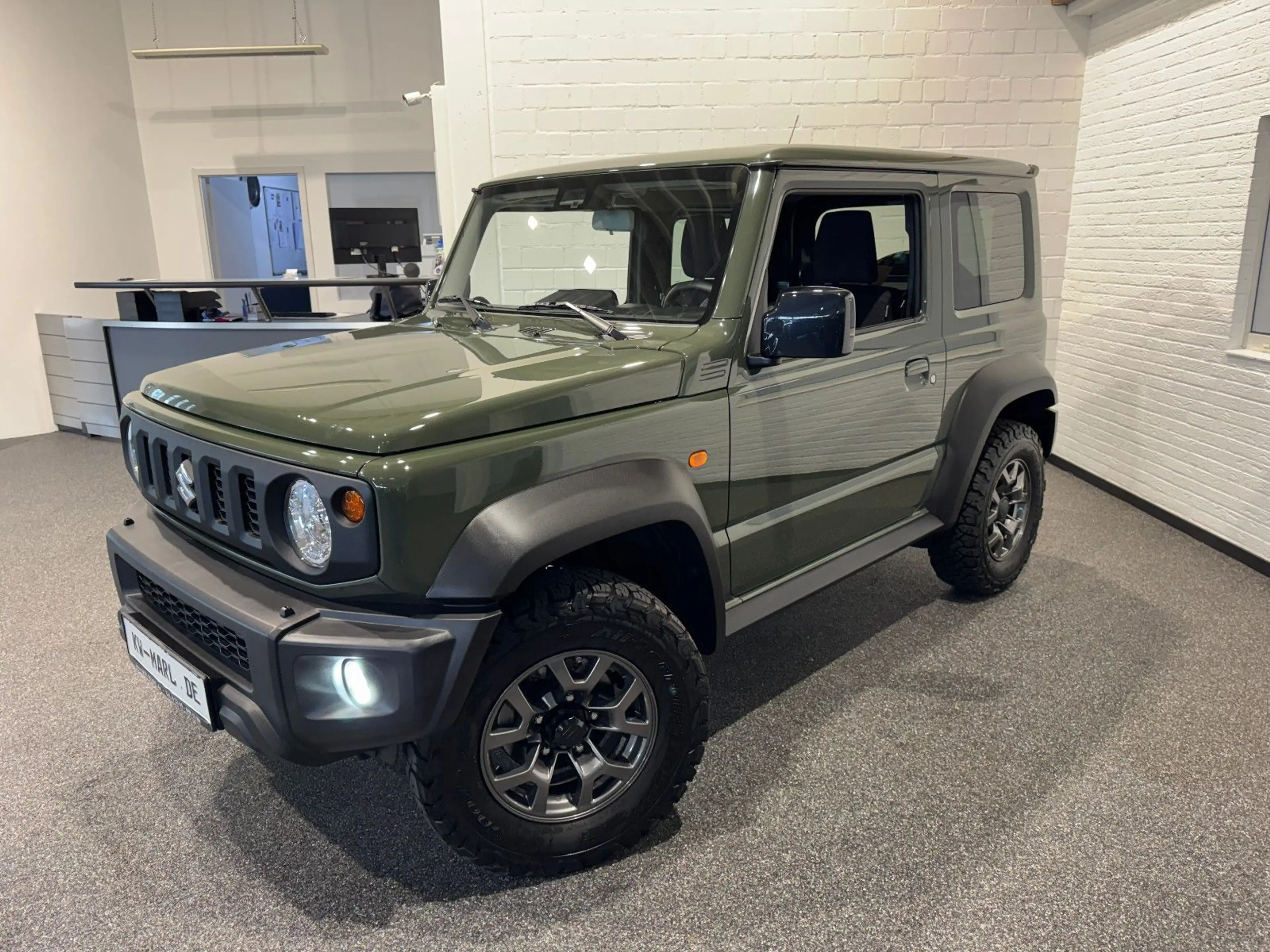 Suzuki Jimny Comfort+ AllGrip NAVI+CAM NEUWAGENZUSTAND!