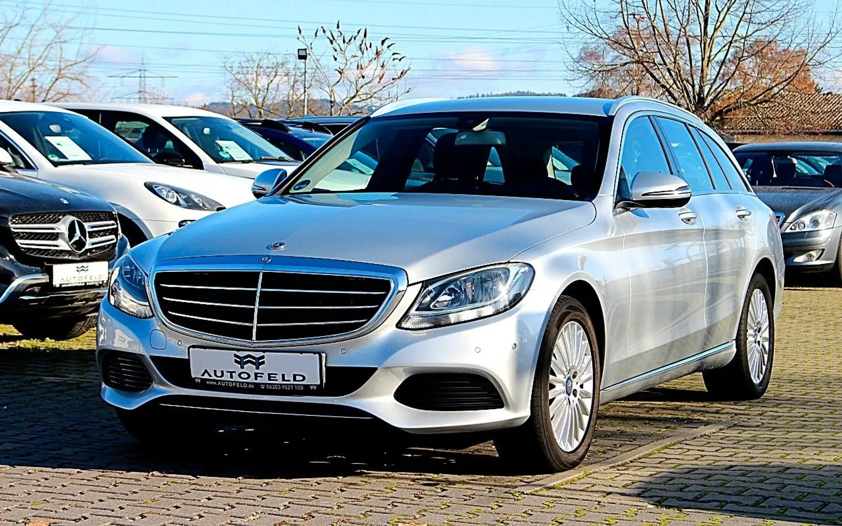 Mercedes-Benz C 200 T AVANTGARDE/SHEFT/AHK/F1/NAVI/SHZ/PDC/BT/ Plateado - 1