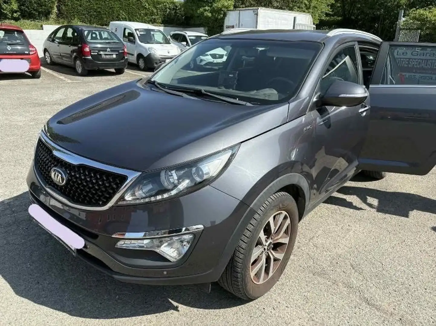 Kia Sportage 2.0 CRDi 4WD Sense Gris - 1