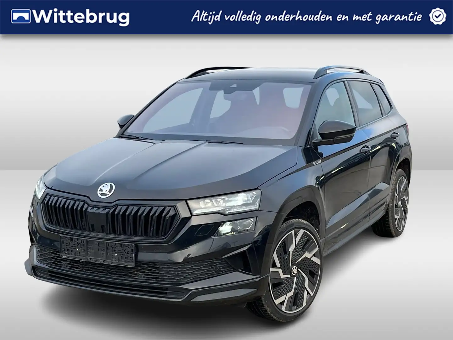 Skoda Karoq 1.5 TSI ACT Sportline Business / 19"LMV / CAMERA / Zwart - 1