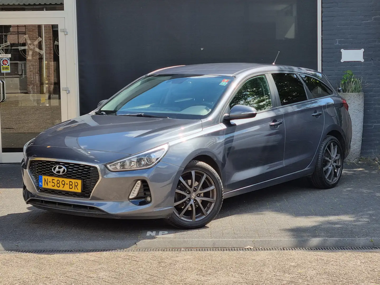 Hyundai i30 1.4 i-Drive NAVI / AIRCO / CRUISE / BLUETOOTH Grigio - 1