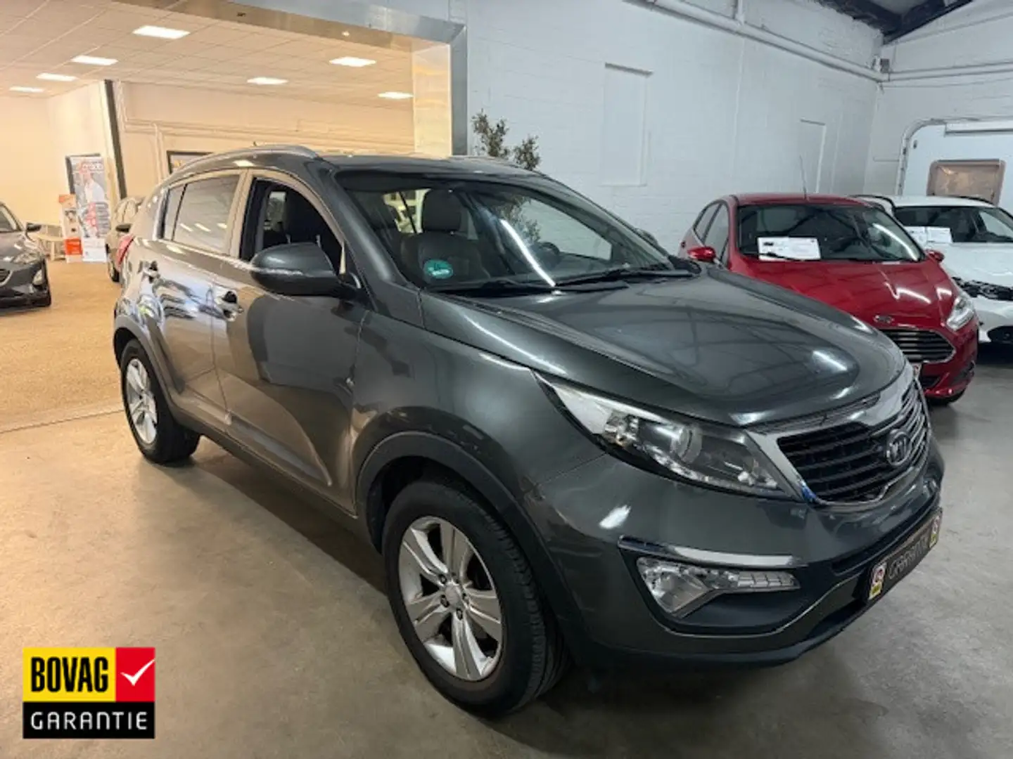 Kia Sportage 2.0 X-ecutive Plus Grijs - 1