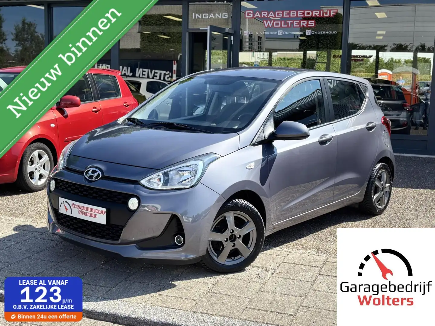 Hyundai i10 1.0i i-Premium AIRCO NAVI CRUISE LMV NW APK Grijs - 1