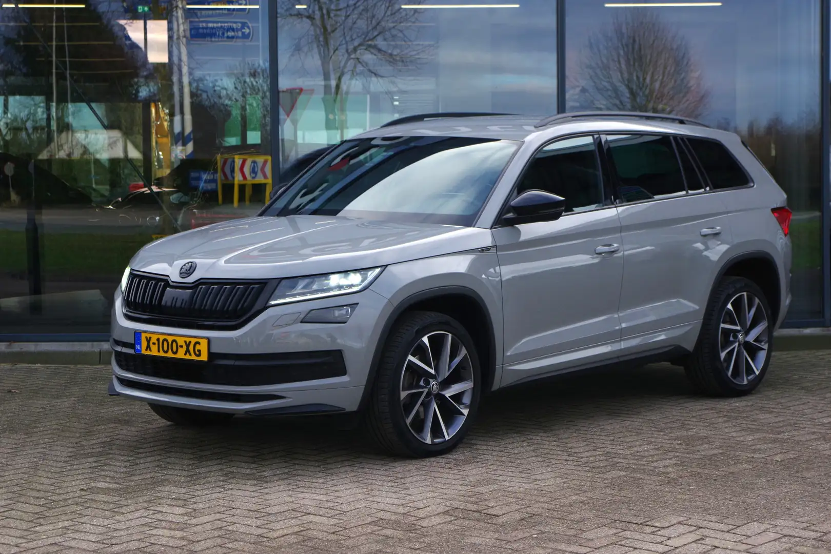 Skoda Kodiaq 2.0 TDI 150 PK Sportline Business 7p, Trekhaak, Ad Grau - 1