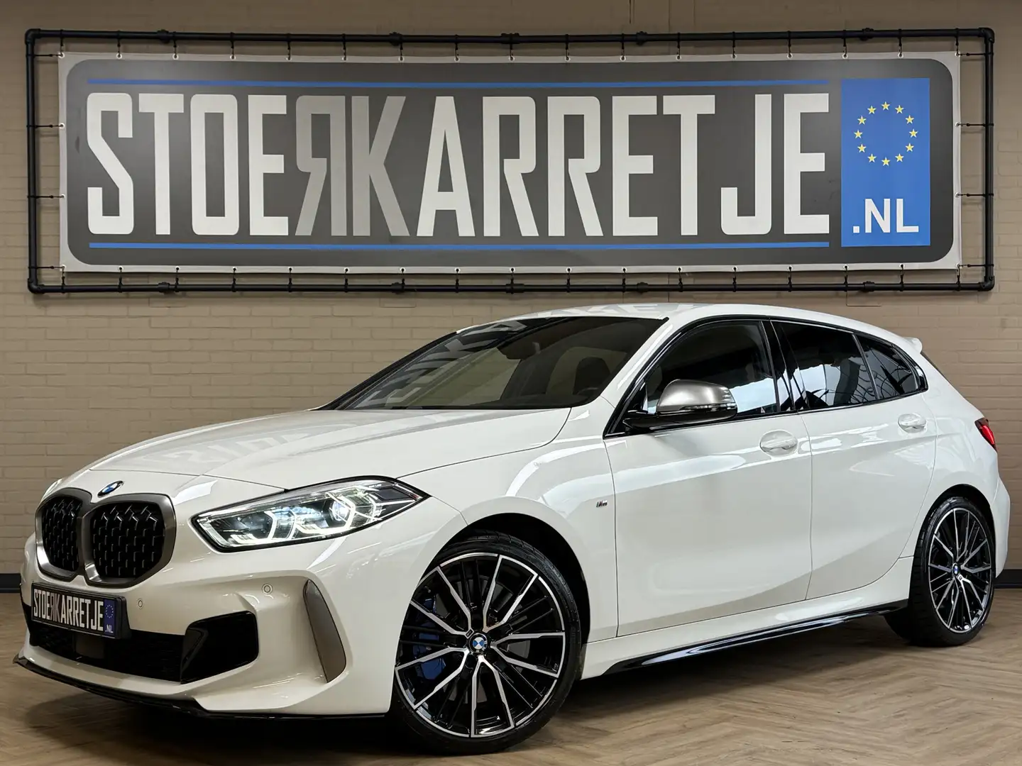 BMW 135 1-serie M135i xDrive High Executive Navi | 19" | A Wit - 1