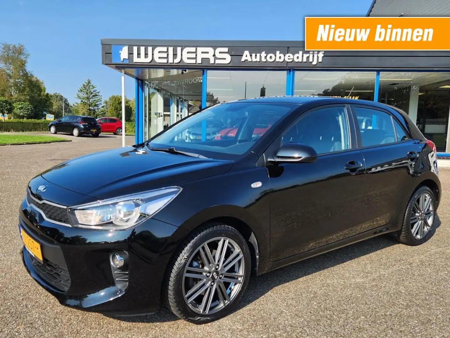 Kia Rio 1.0 TGDI Comfortline Navigator, Apple/ Android, Ca Zwart - 1