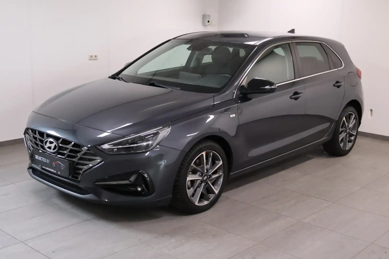 Hyundai i30 1.5 T-GDi MHEV Premium | Leder | Navi! Grijs - 1