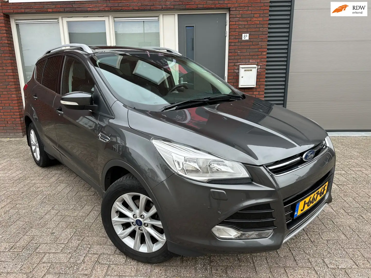 Ford Kuga 1.5 Titanium / Schuifdak / Leder / Navi / Stoelver Gris - 1