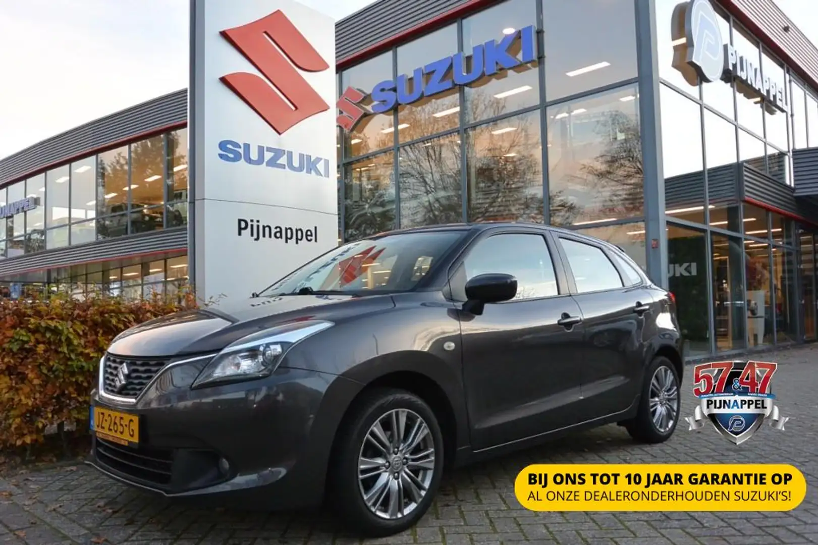 Suzuki Baleno 1.2 Exclusive 5-deurs Trekhaak/Allseason banden Grau - 1