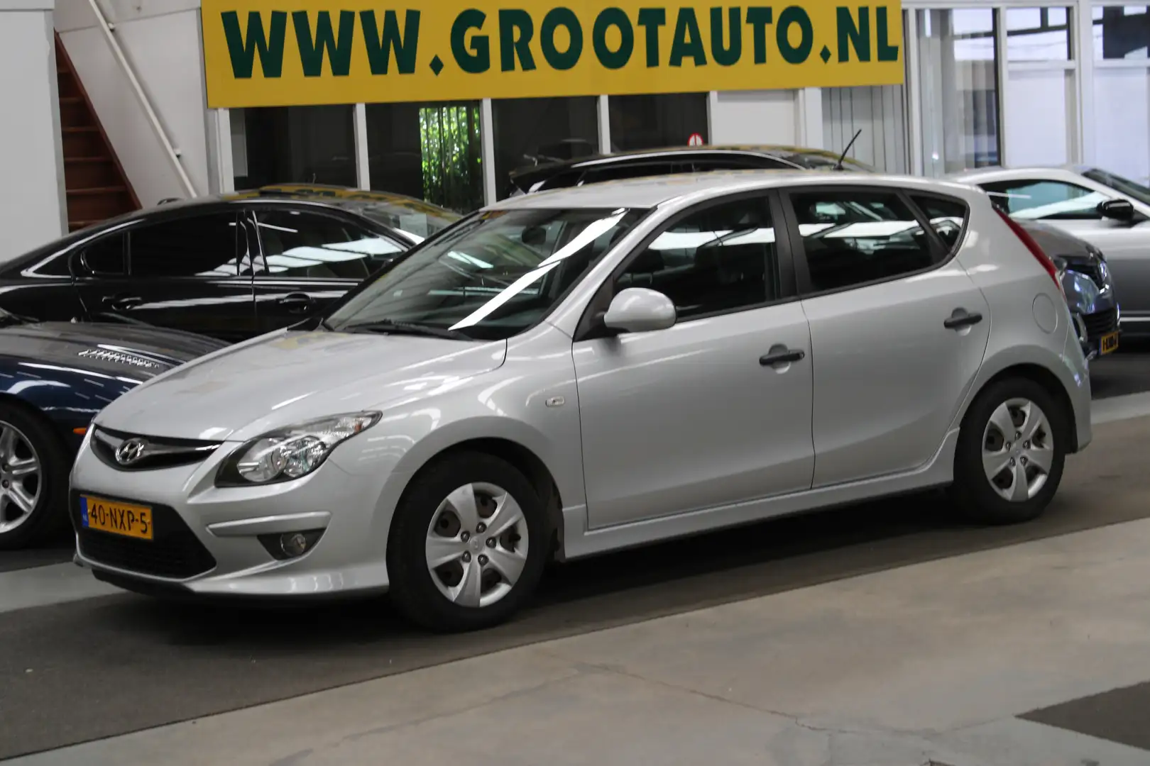Hyundai i30 1.4i i-Drive Cool Airco, Isofix, Stuurbekrachtigin Grijs - 1