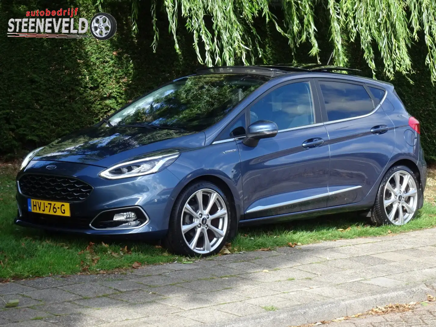 Ford Fiesta 1.0 140pk Viginale met Navi, Pano en WinterPack Blauw - 1
