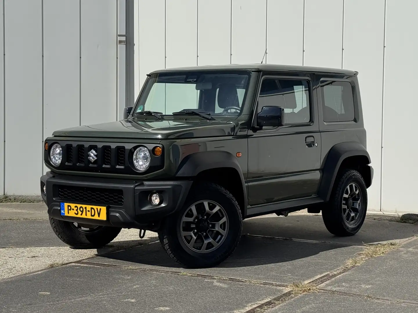 Suzuki Jimny 1.5 Stijl AllGrip 4-pers. / Clima / Cruise / Led Verde - 1