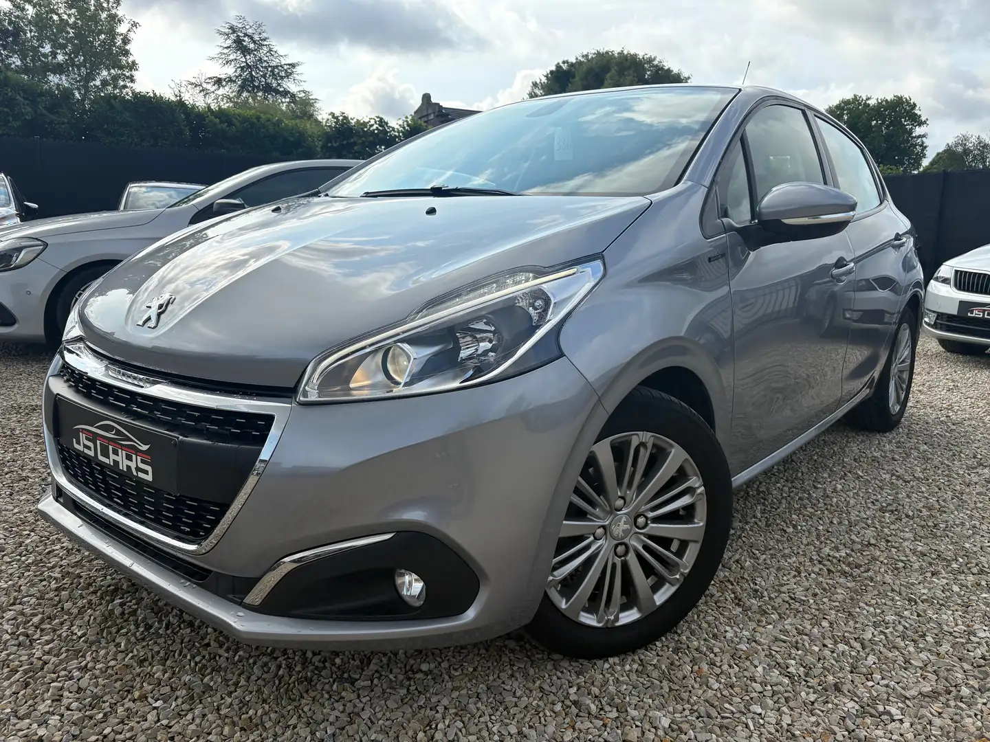 Peugeot 208 1.2i*SIGNATURE*60000KM*NAVIGATION*AIRCO*PDC* Gris - 1