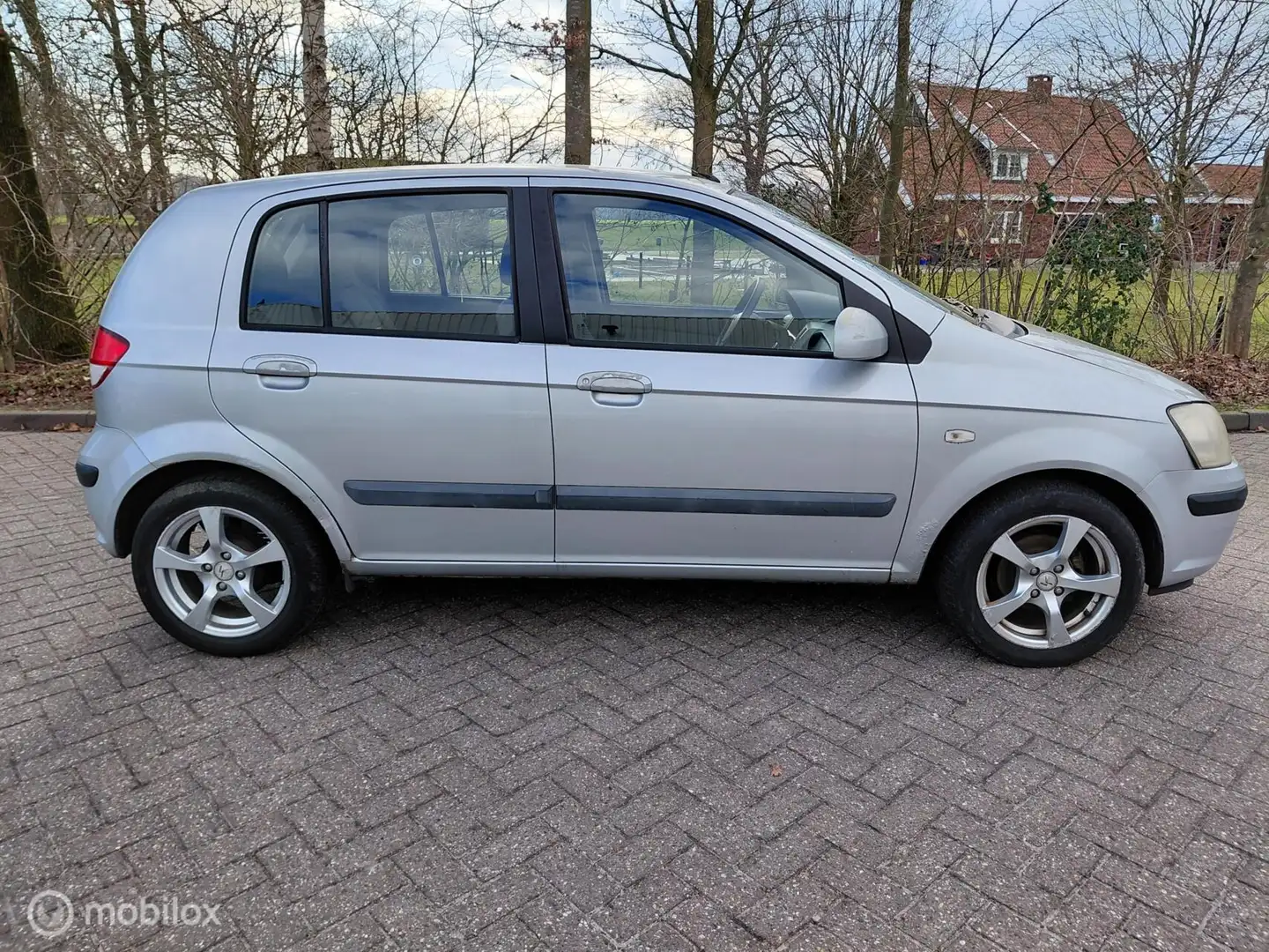 Hyundai Getz 1.3i 60 KW 82 PK GLS Sky Airco KM 186852 NAP Grau - 2