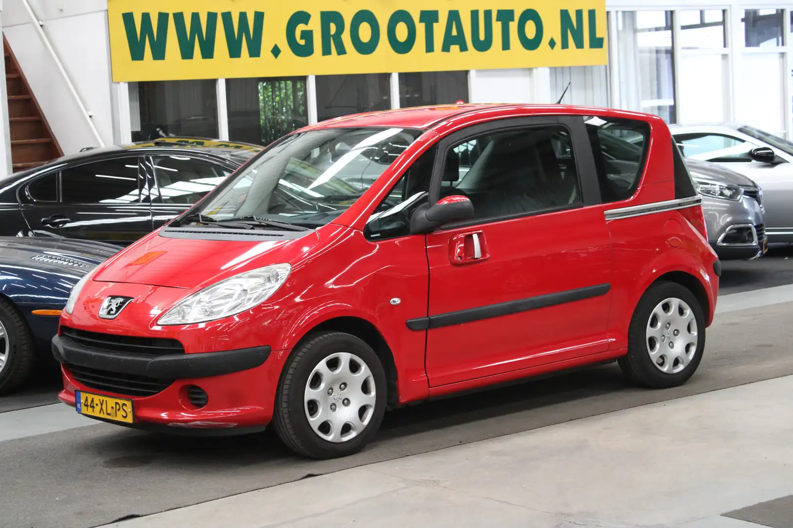Peugeot 1007 1.4 Sesam Urban Airco, Isofix, Trekhaak, Stuurbekr Rosso - 1