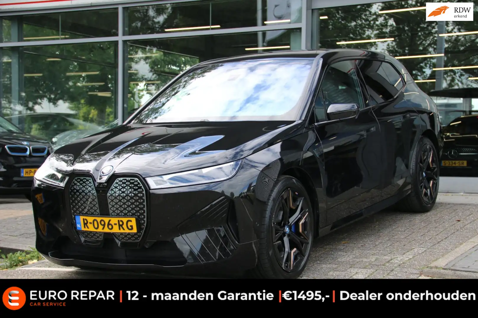 BMW iX XDrive40 Executive 77 kWh INCL BTW TREKHAAK Zwart - 1