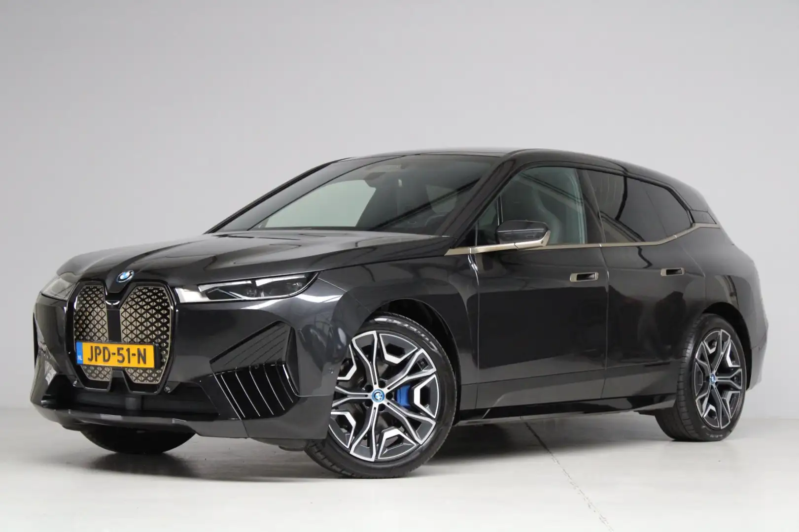 BMW iX XDrive50 High Executive 112 kWh | panoramadak skyl Grijs - 1