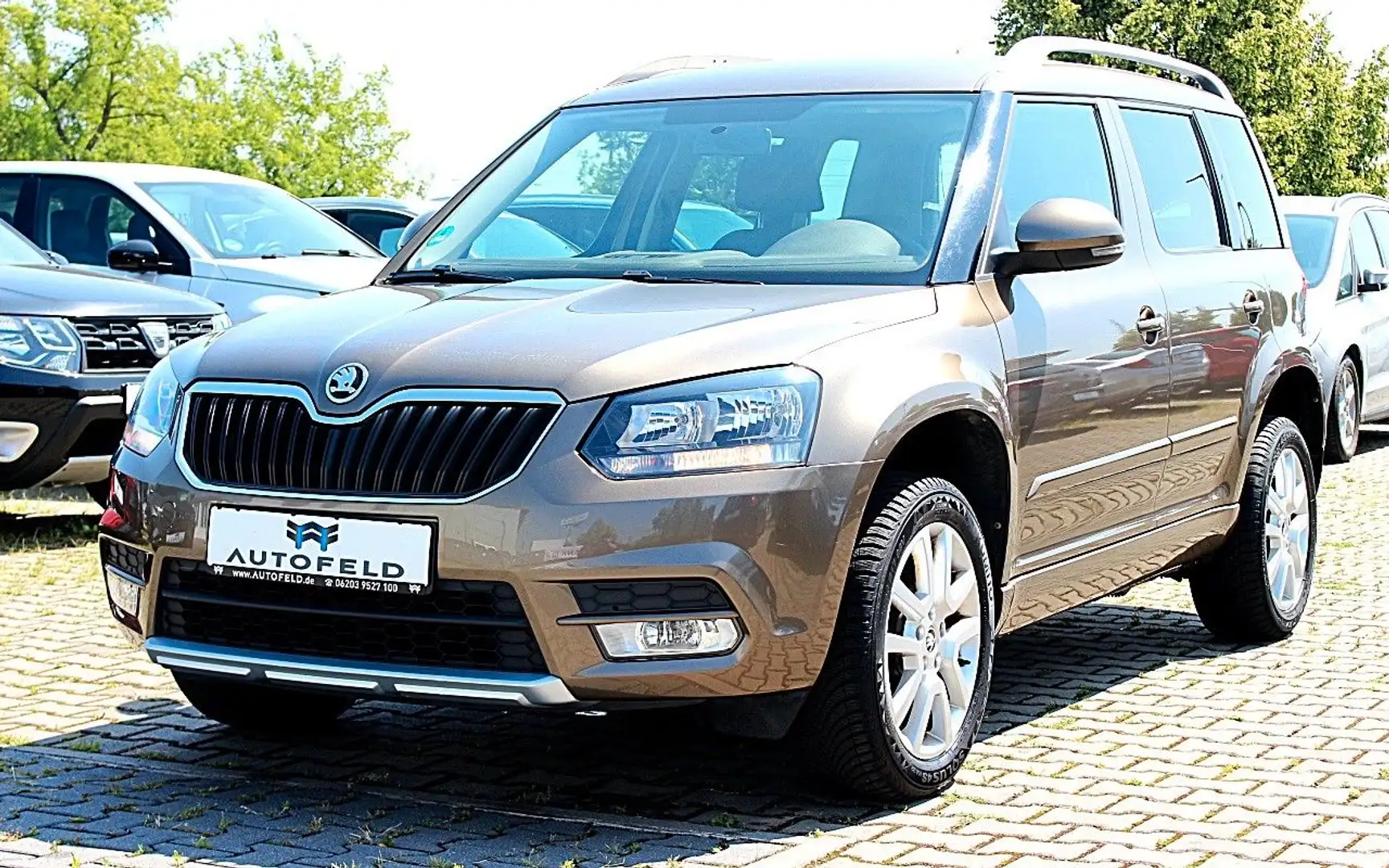 Skoda Yeti 1.2 TSI/VOLL SHEFT/KLIMA/SHZ/PDC/ALLWETTER/ Braun - 1