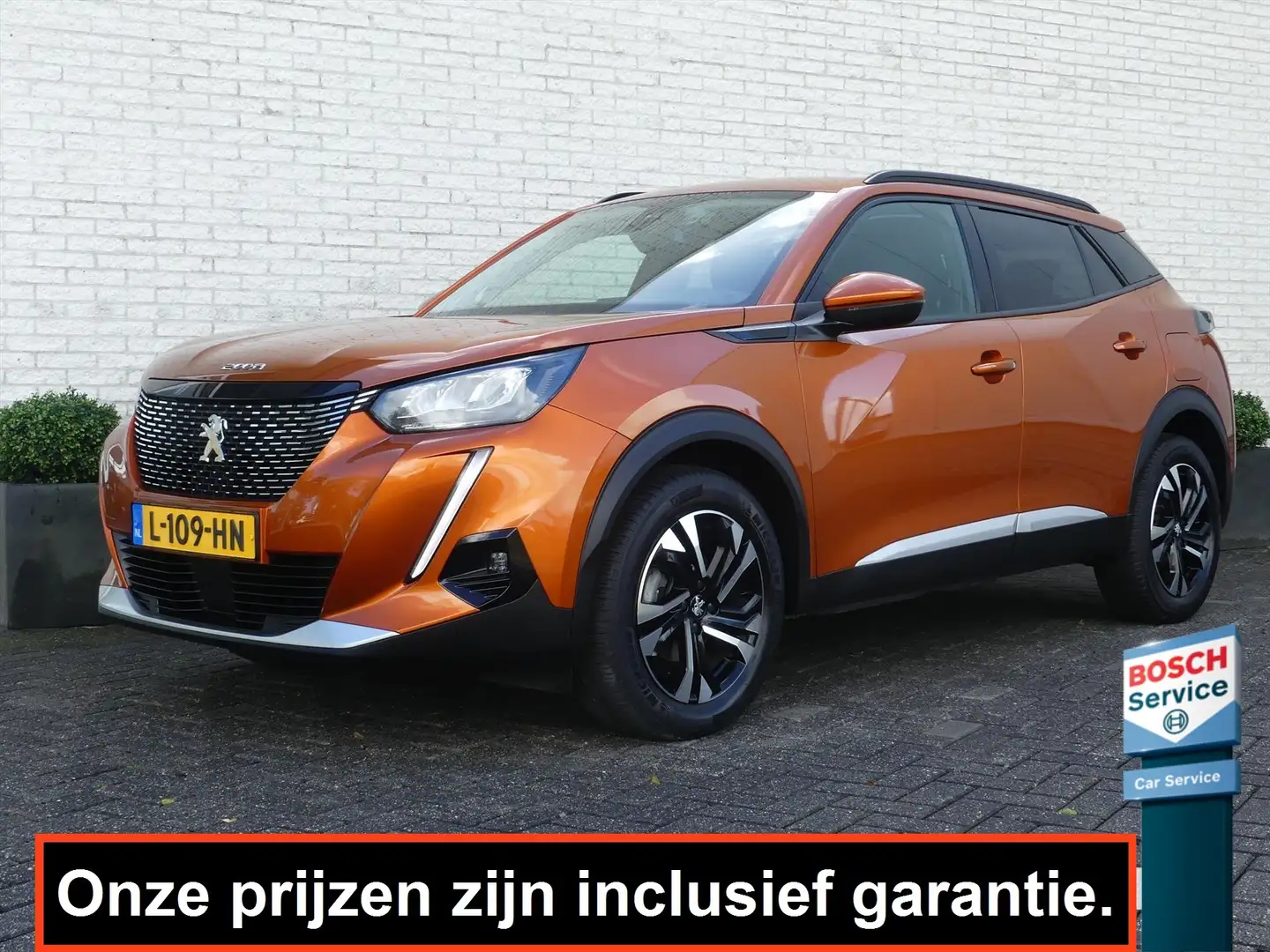 Peugeot 2008 ALLURE 1.2 130PK CAMERA/TREKHAAK/NAVI/PDC/i-COCKPI Oranje - 1