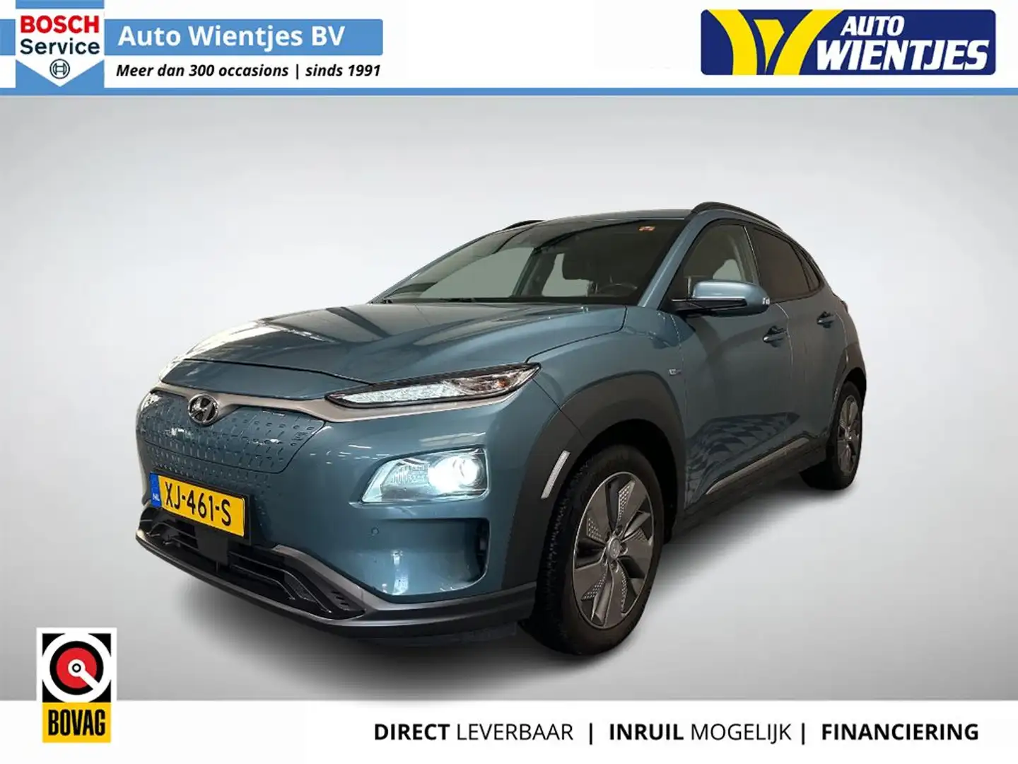 Hyundai KONA EV Premium 64kWh | SOH 100% | Leer | Navi | Trekha Blauw - 1