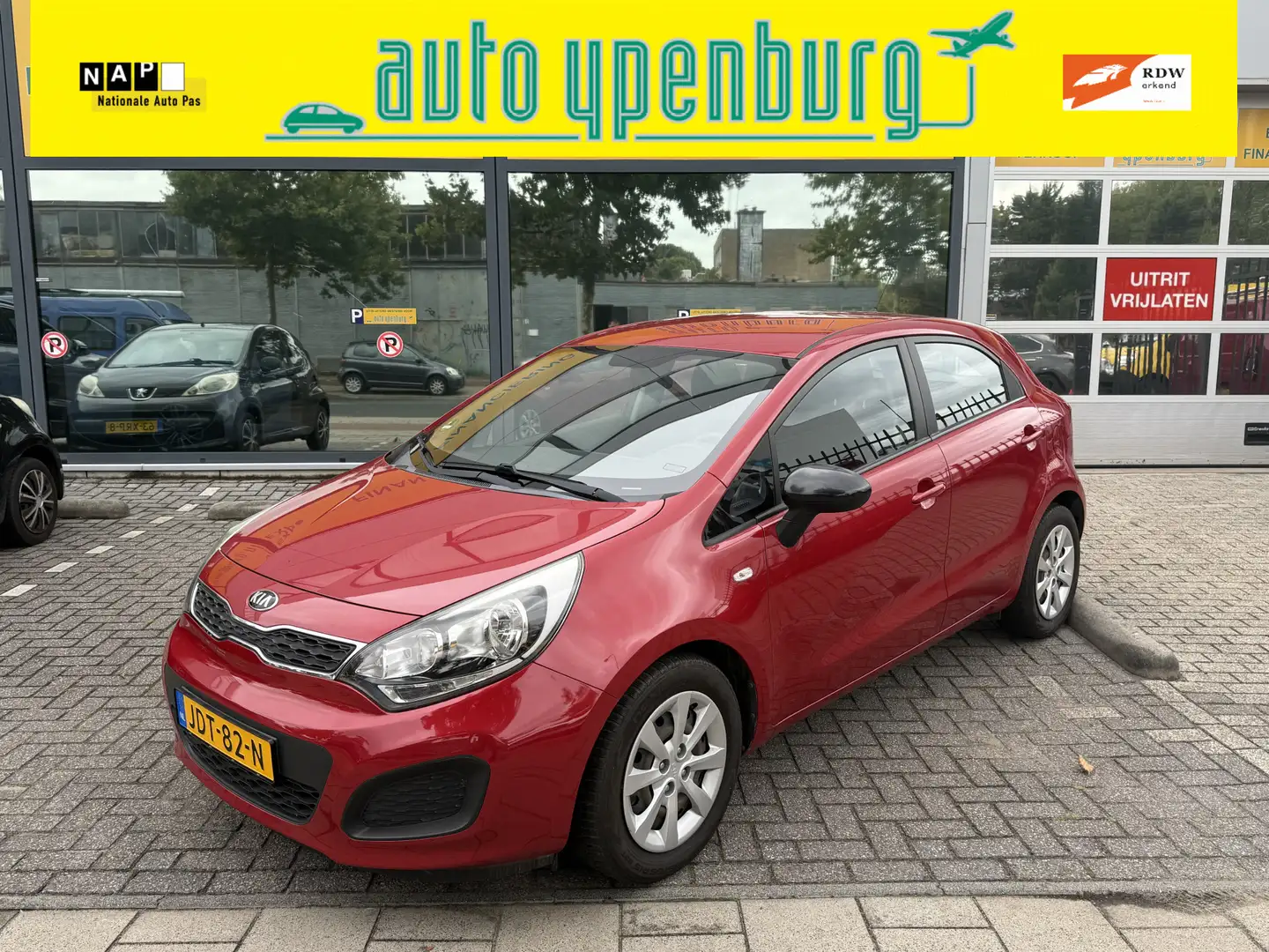 Kia Rio 1.2 CVVT ExecutiveLine * Airco * 5 Deurs * PDC Ach Rood - 1