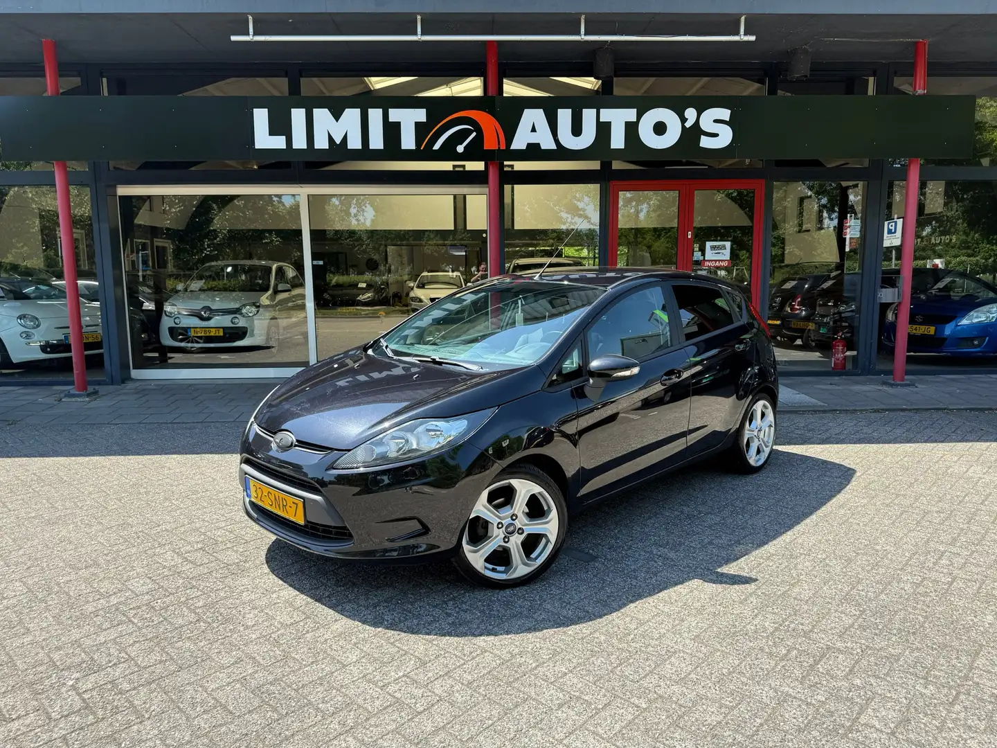 Ford Fiesta 1.25 Limited Airco/Cruise/El.armen/Lmv/Nap/Apk Zwart - 1