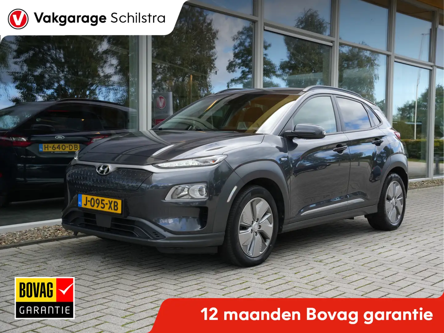 Hyundai KONA EV Fashion 64 kWh 3 Fase | SoH 100% | Navigatie | Grijs - 1