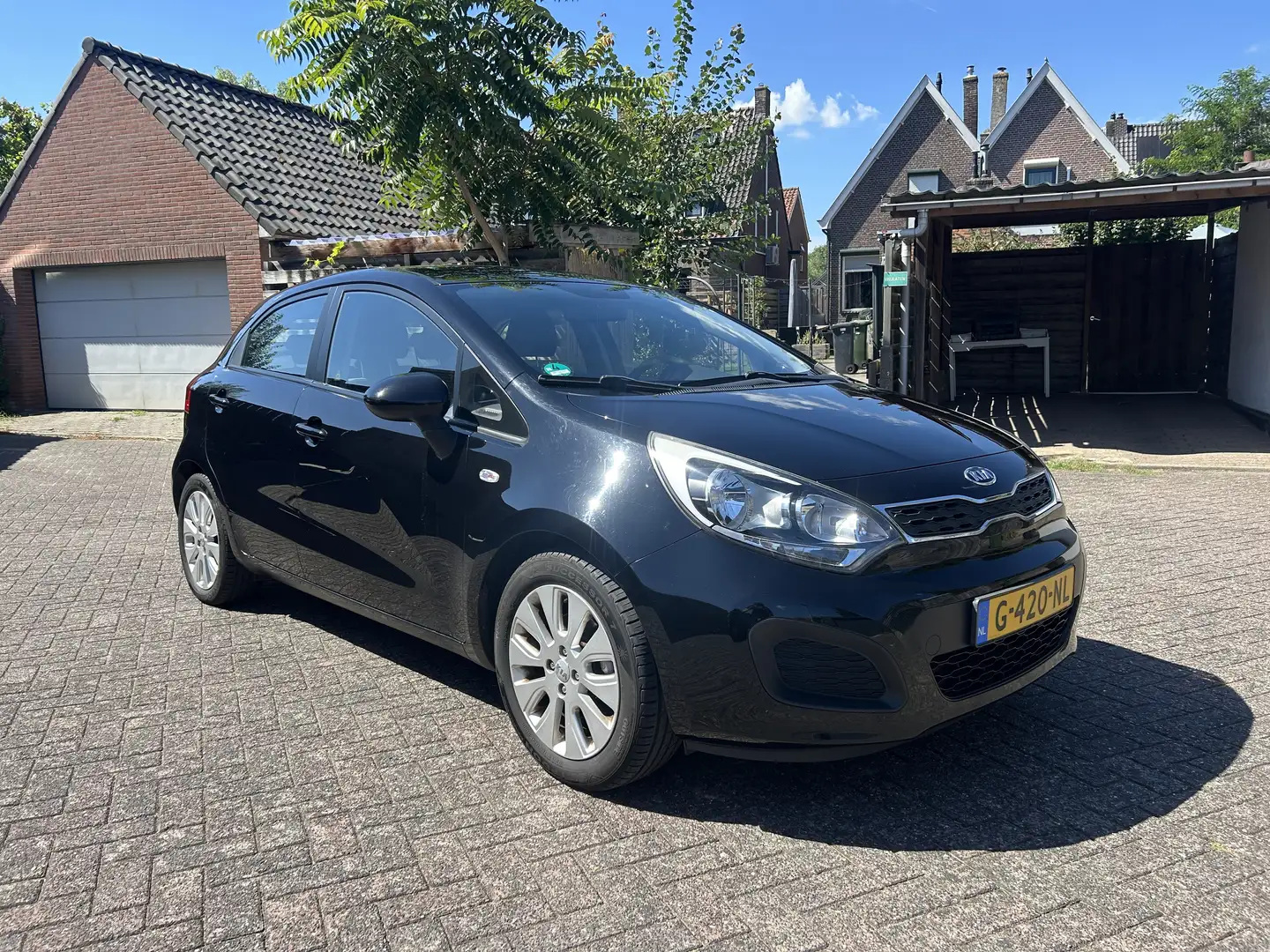 Kia Rio 1.4 CVVT Comf. Pack Zwart - 1