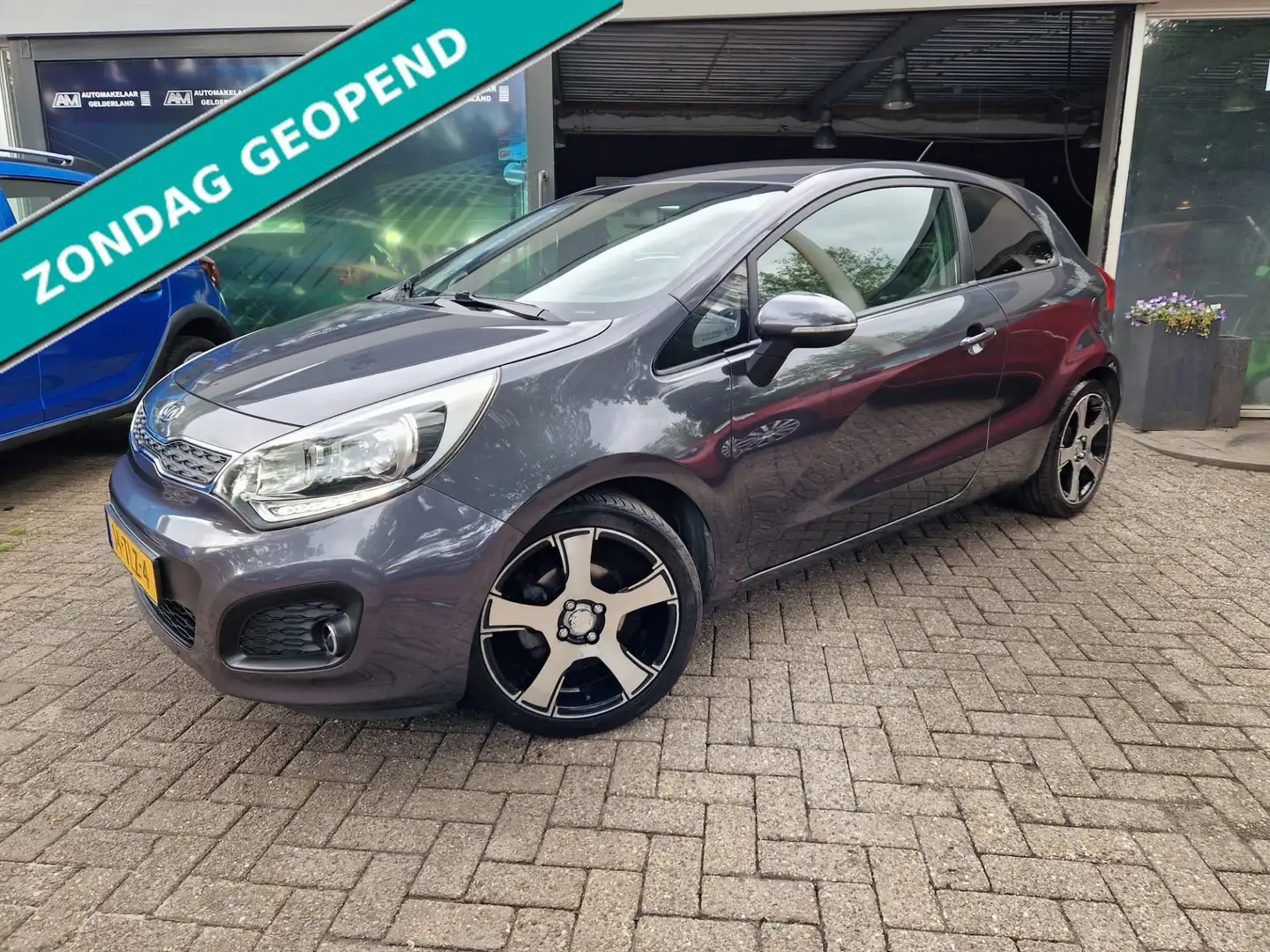 Kia Rio 1.2 CVVT Super Pack 2E EIGENAAR|NW APK|12 MND GARA Grijs - 1