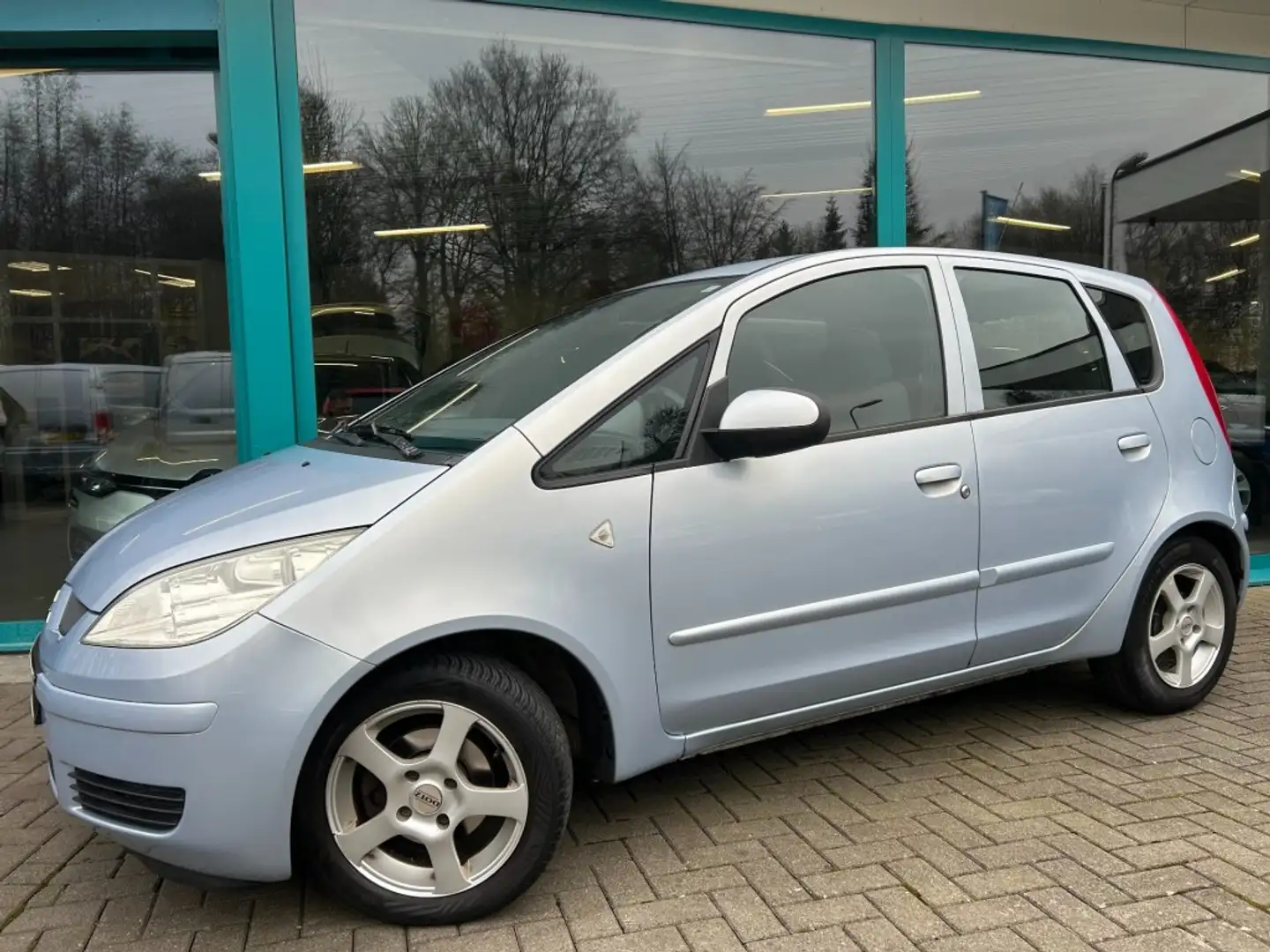 Mitsubishi Colt 1.3 INFORM Airco, 15Inch, El.pakket, NAP Grijs - 1