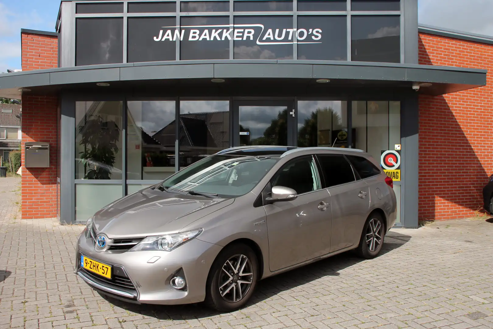 Toyota Auris Touring Sports 1.8 Hybrid Lease ✅ AC ✅ Automaat ✅ Bruin - 1