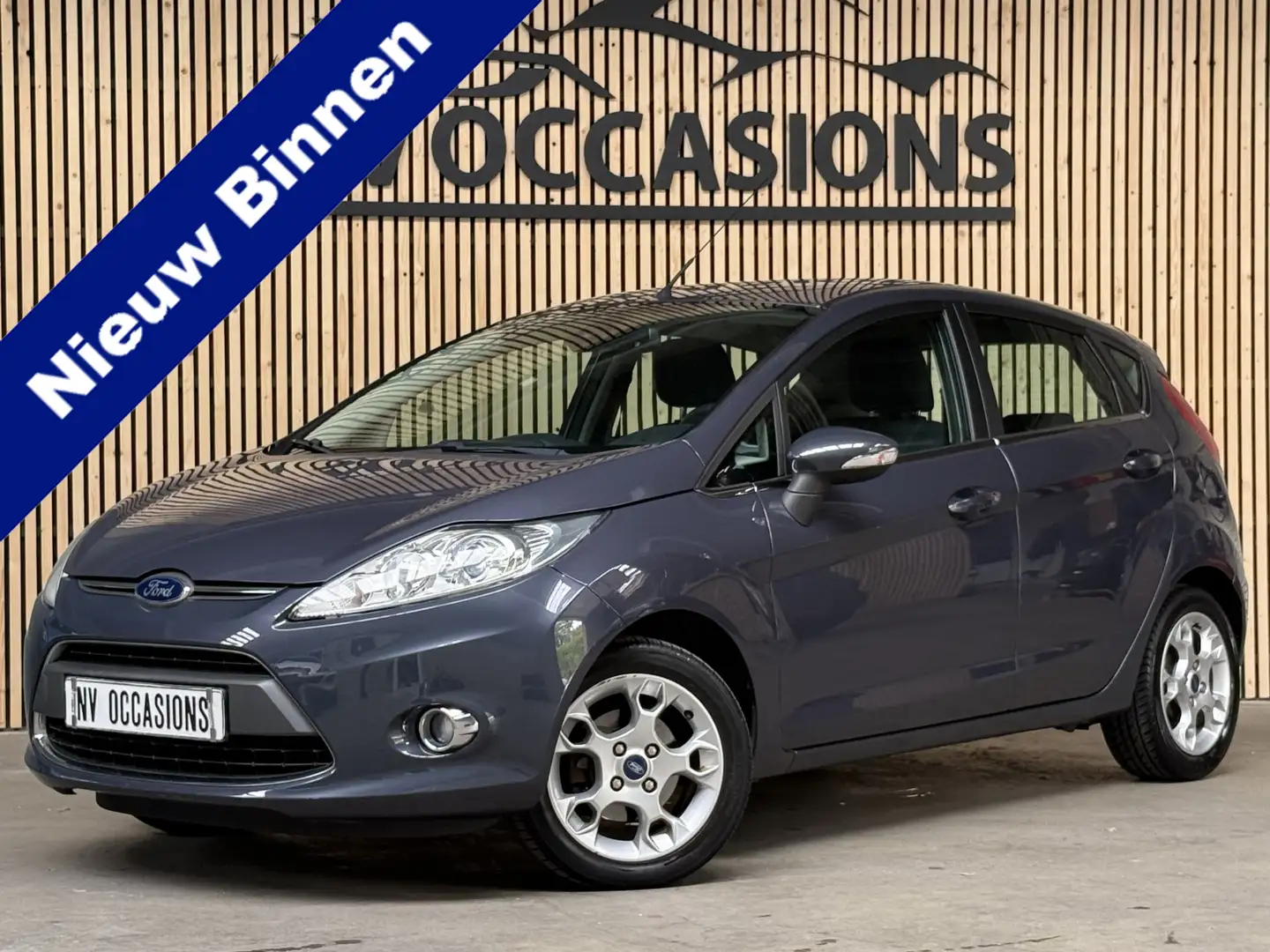 Ford Fiesta 1.25 Titanium ECC/PDC/VOORRUITVW/80DKM/CRUISE/NAP/ Grijs - 1