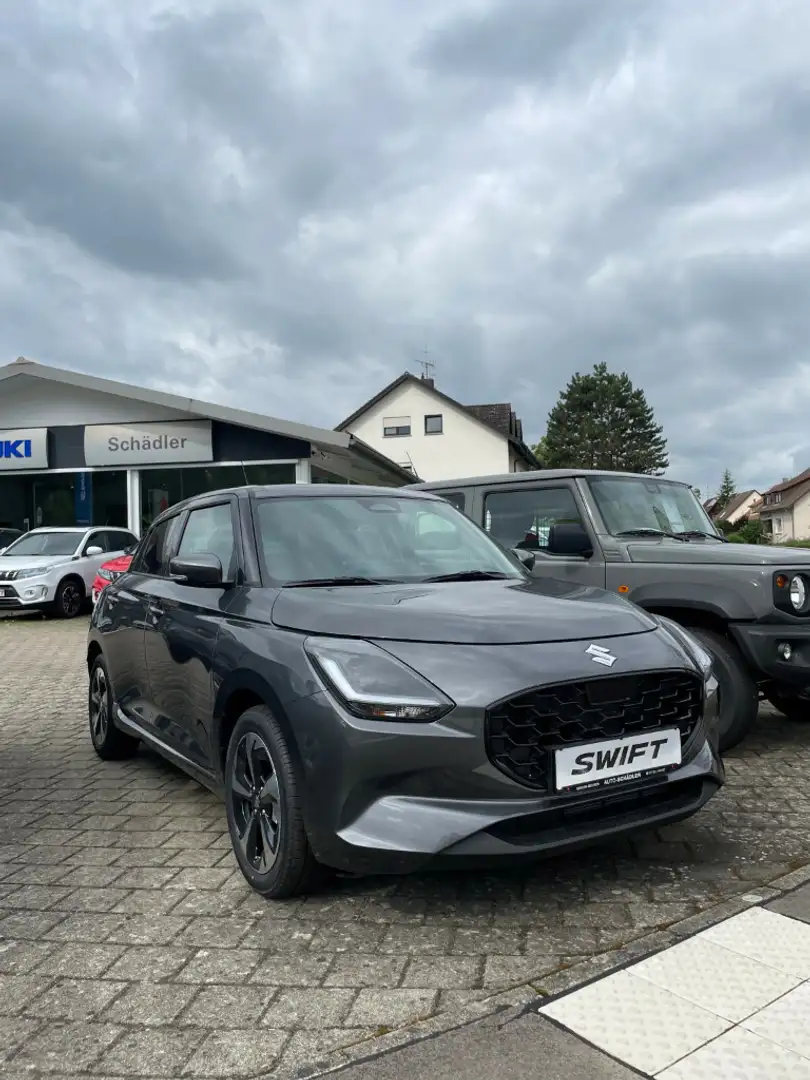 Suzuki Swift 1.2 Dualjet Hybrid 61 kW Comfort+ Grijs - 1